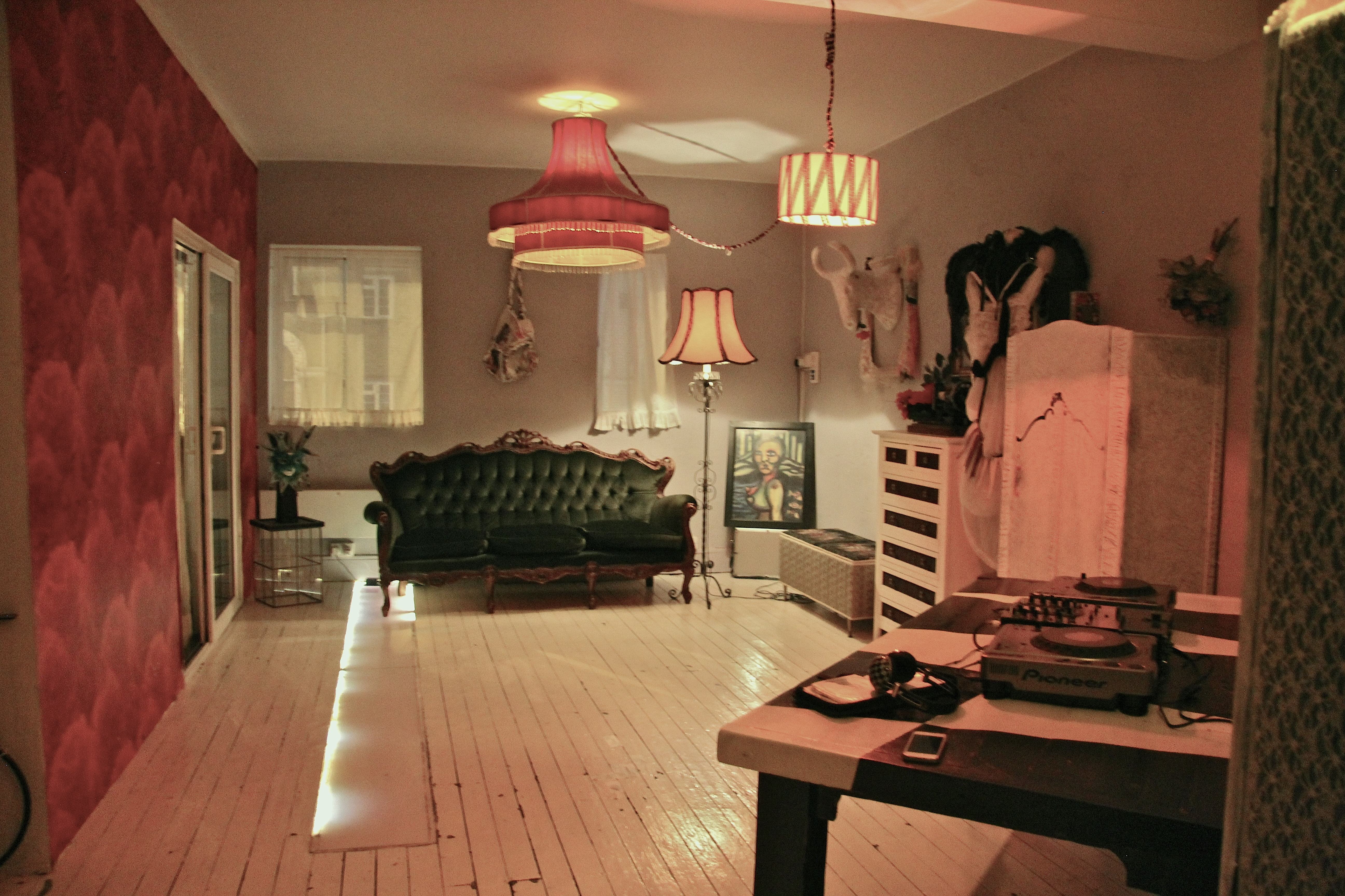 Stylish Dalston Popup Loft venue with vintage green sofa for creative events and workshops.
