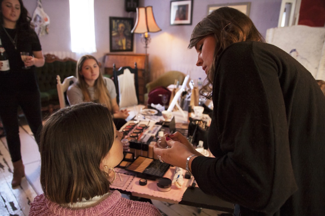 Cozy beauty workshop at Dalston Popup Loft with makeup artist and engaged clients.
