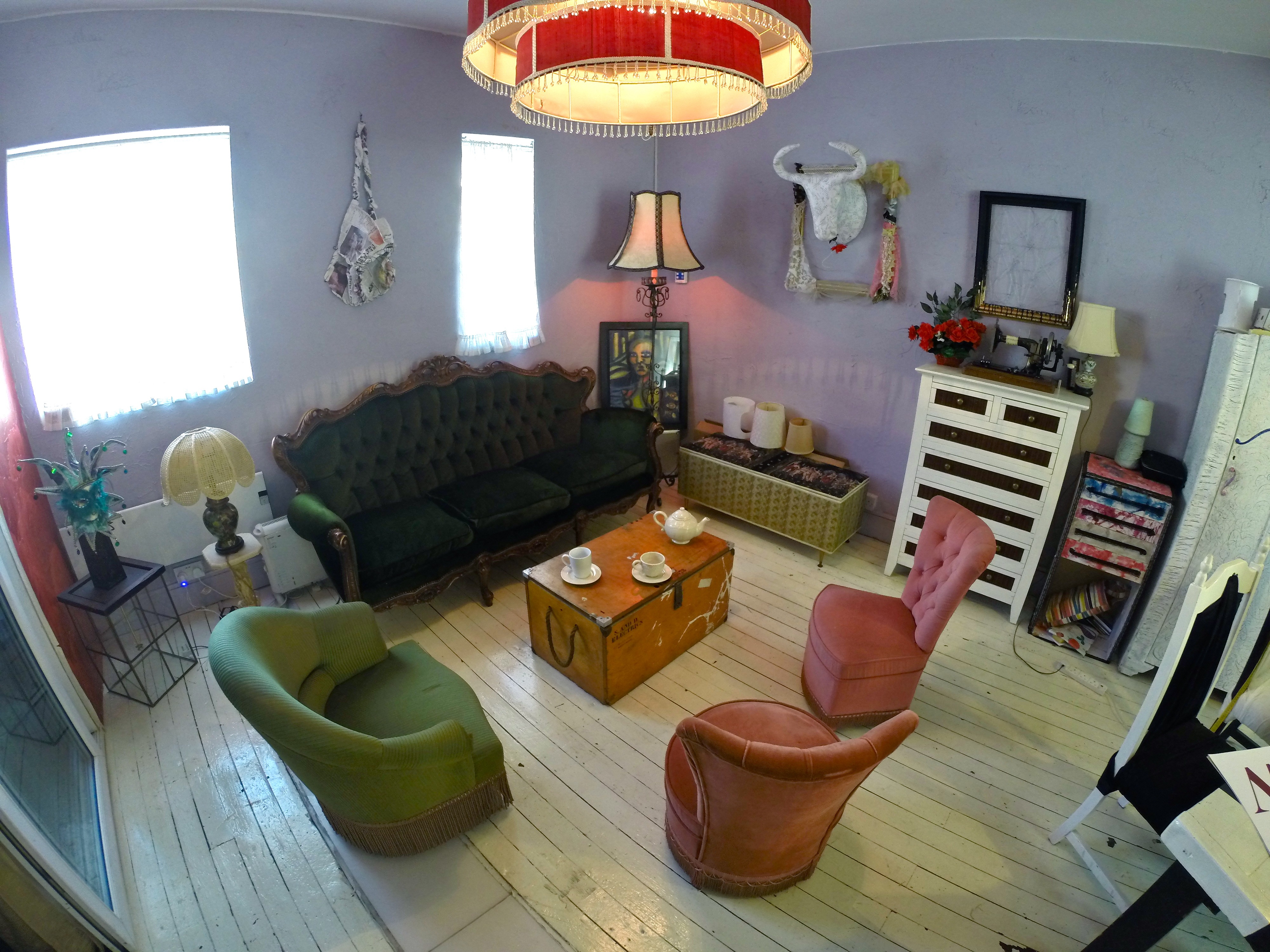 Cozy meeting space in Dalston Popup Loft with vintage furniture for intimate gatherings.