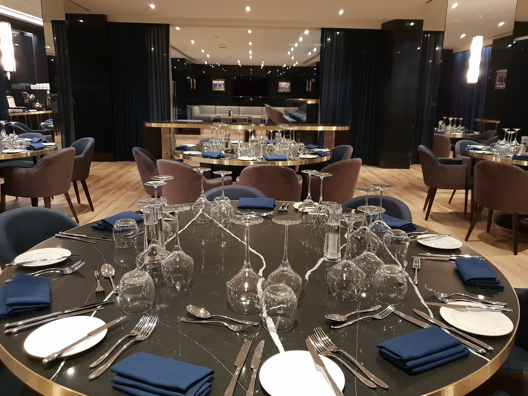 Elegant dining setup in The Directors Lounge, Chelsea FC for corporate events and celebrations.