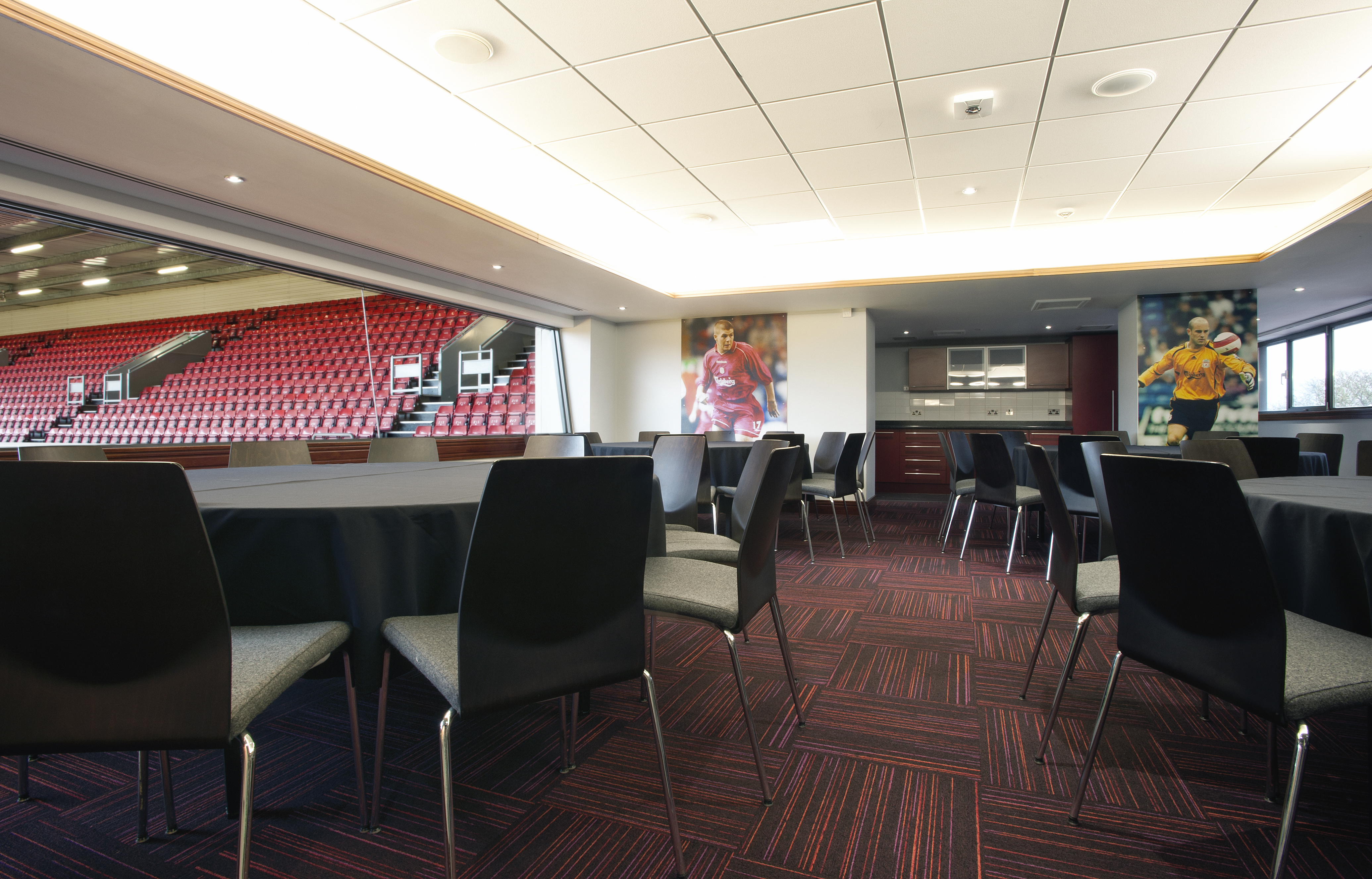 Modern event space in Liverpool FC with stadium views, perfect for corporate meetings.