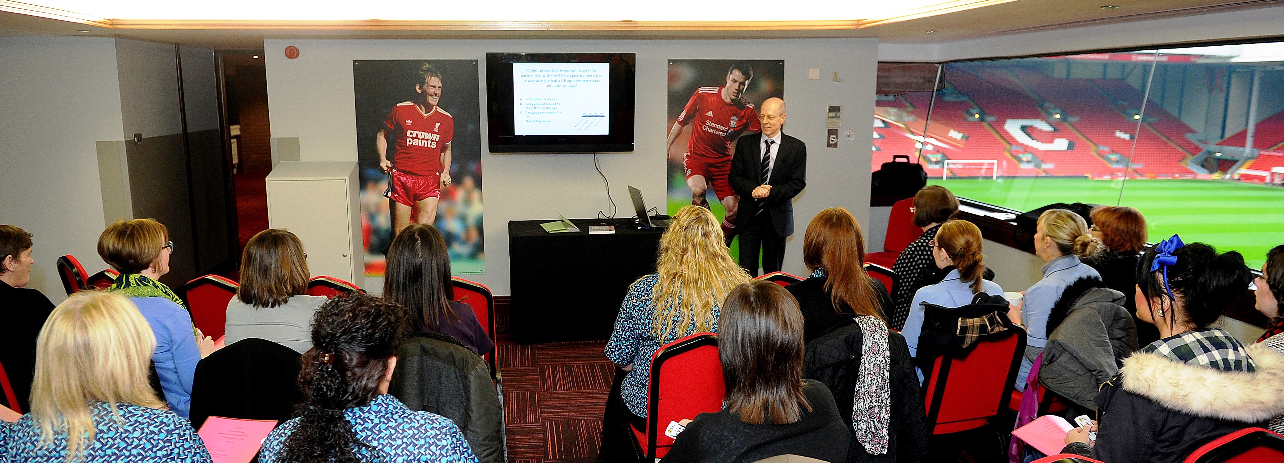 Executive box 1A at Liverpool FC hosting a professional meeting with engaging visuals.