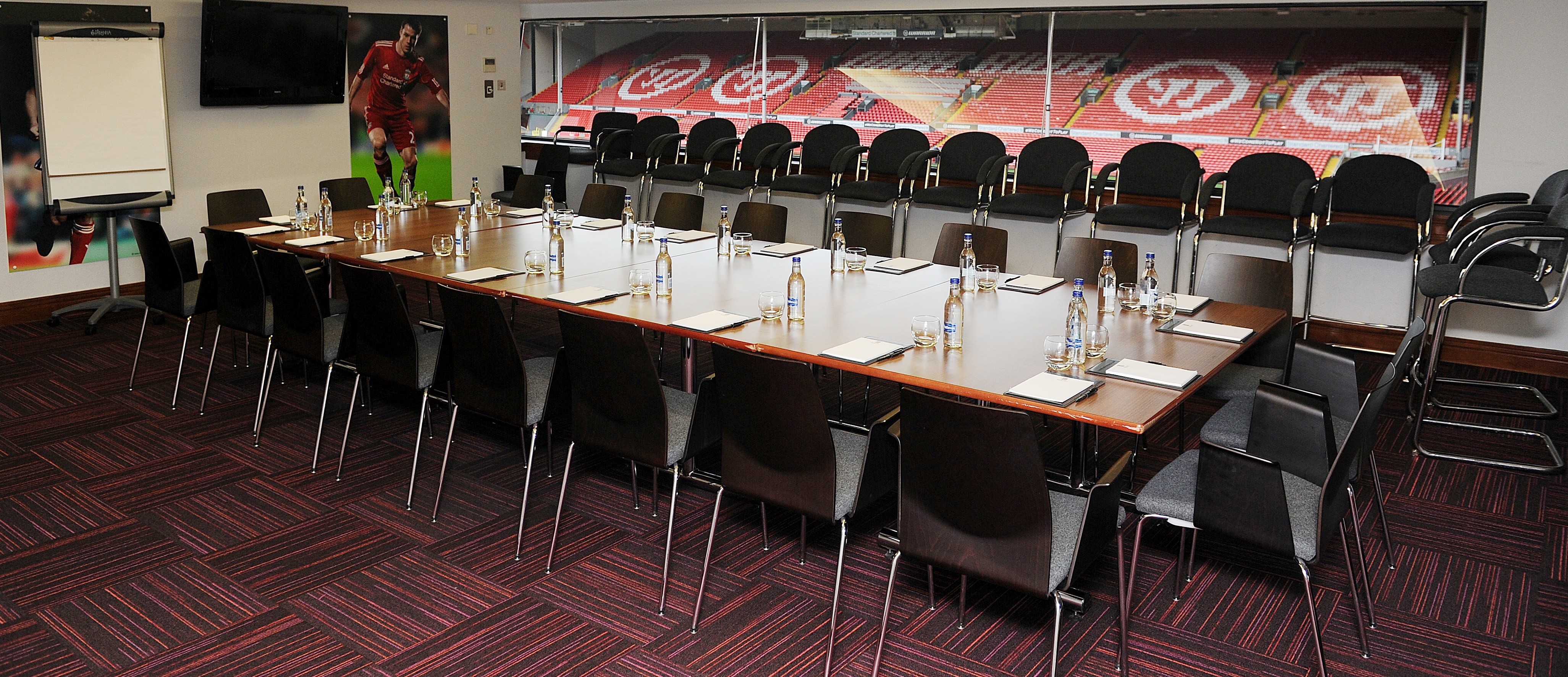 Executive box 1A at Liverpool FC: sleek meeting room for corporate events with stadium view.