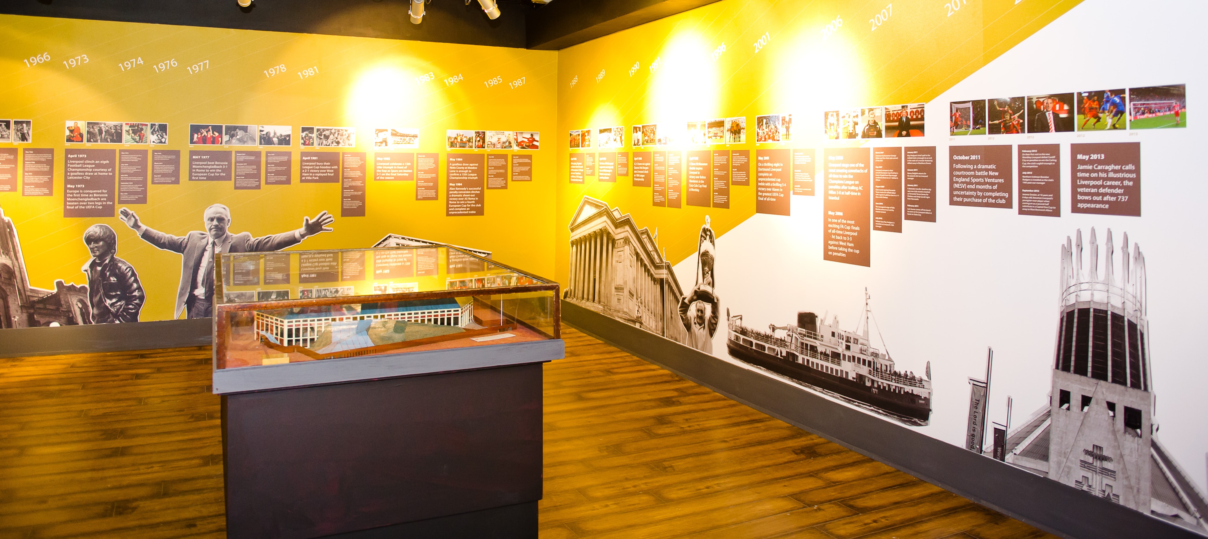 Liverpool FC Story exhibition space with vibrant displays, ideal for events and meetings.