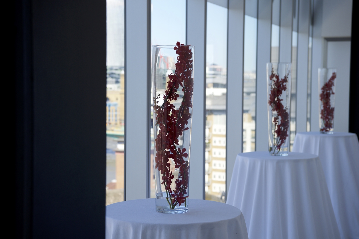 Elegant floral arrangements in Tate Modern's East Room for upscale events.