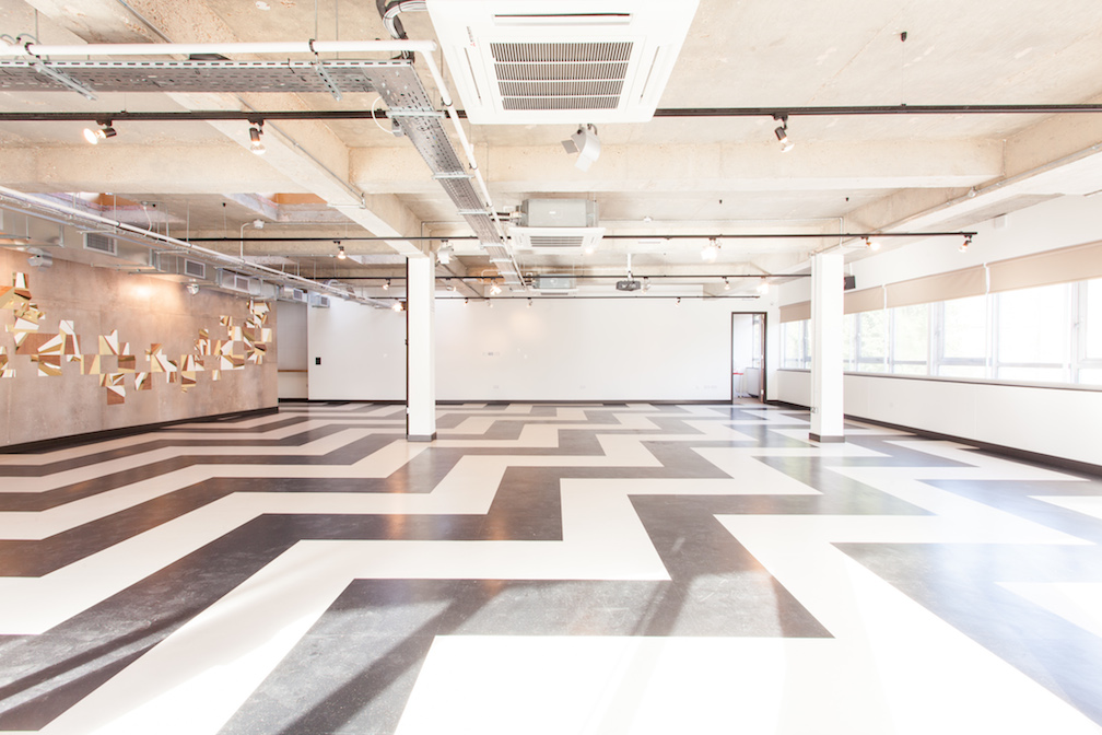 Versatile event space with zigzag flooring at The Trampery Old Street for meetings and workshops.