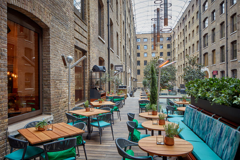 Stylish outdoor venue with rustic architecture, perfect for events and gatherings.