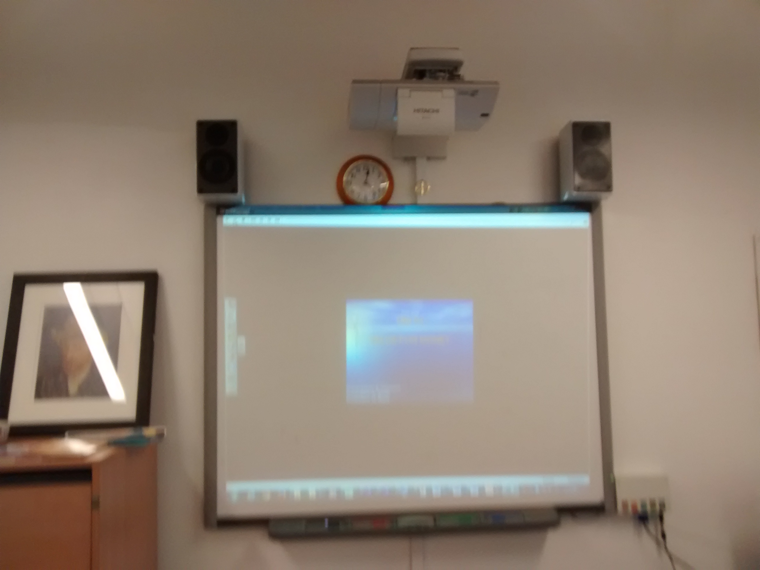 Training room with projector and screen for effective meetings and presentations.
