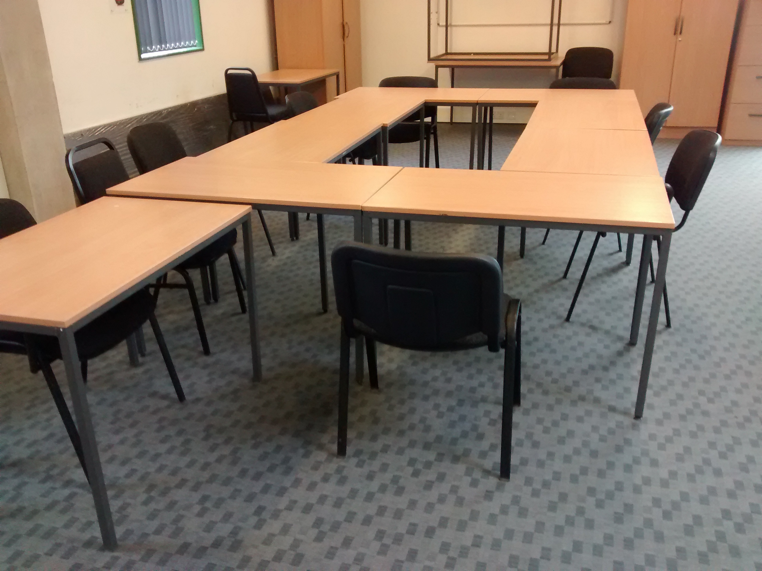U-shaped training room setup for collaborative discussions and presentations.