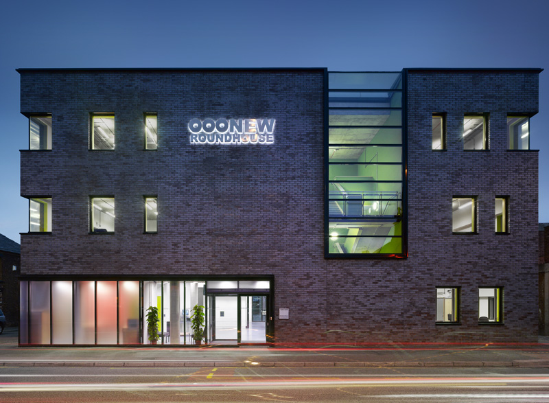 Modern training room with large windows, perfect for corporate meetings and events.