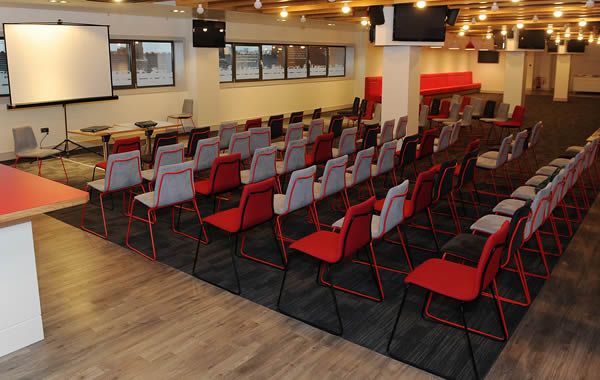 Champions Lounge at Liverpool FC, modern chairs set for presentations and meetings.