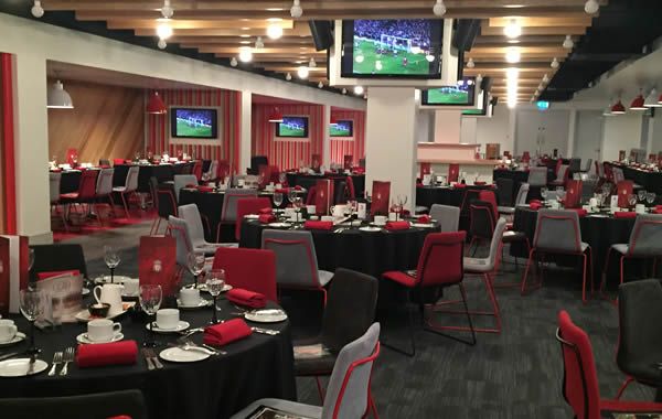 Champions Lounge at Liverpool FC, elegant dinner setup for corporate events and celebrations.