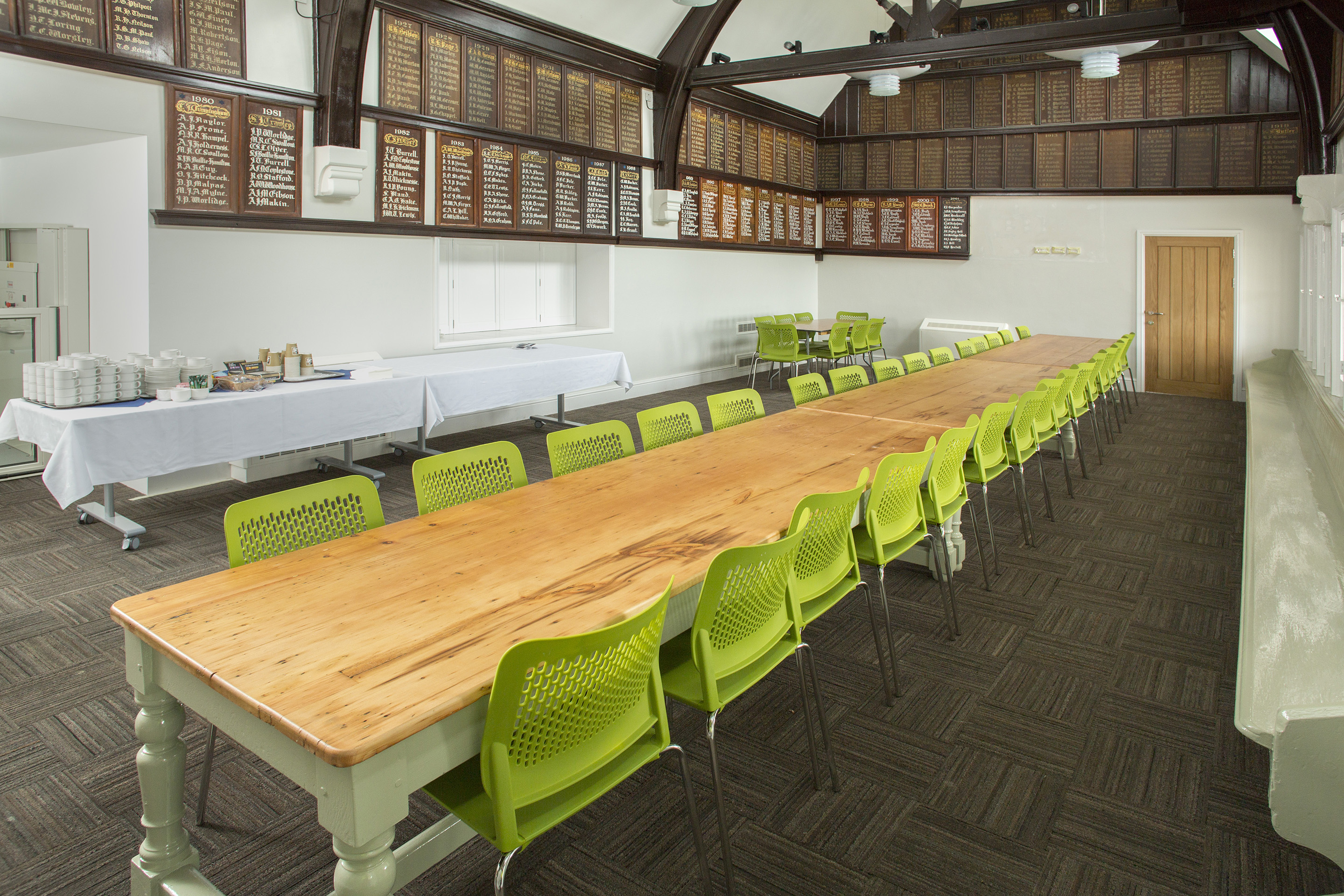 Cricket Pavilion meeting room with wooden table, ideal for workshops and team events.