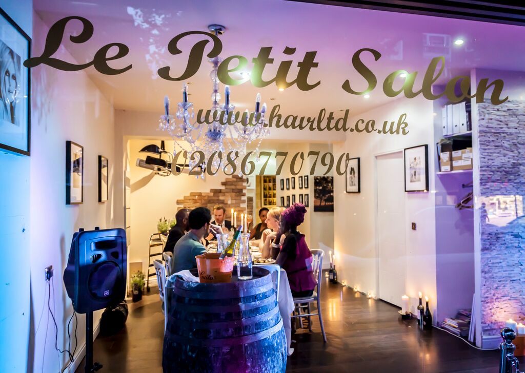 Cozy event space with rustic barrel centerpiece, ideal for networking and private dinners.