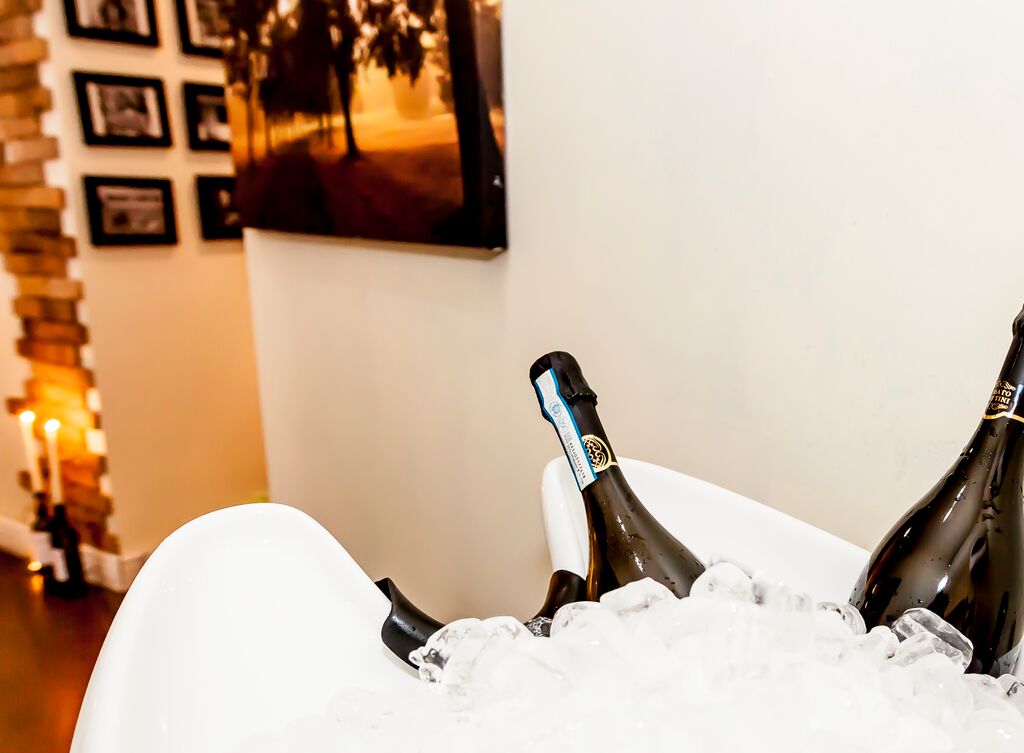 Stylish ice bucket with chilled champagne at a sophisticated event in Le Petit Salon.