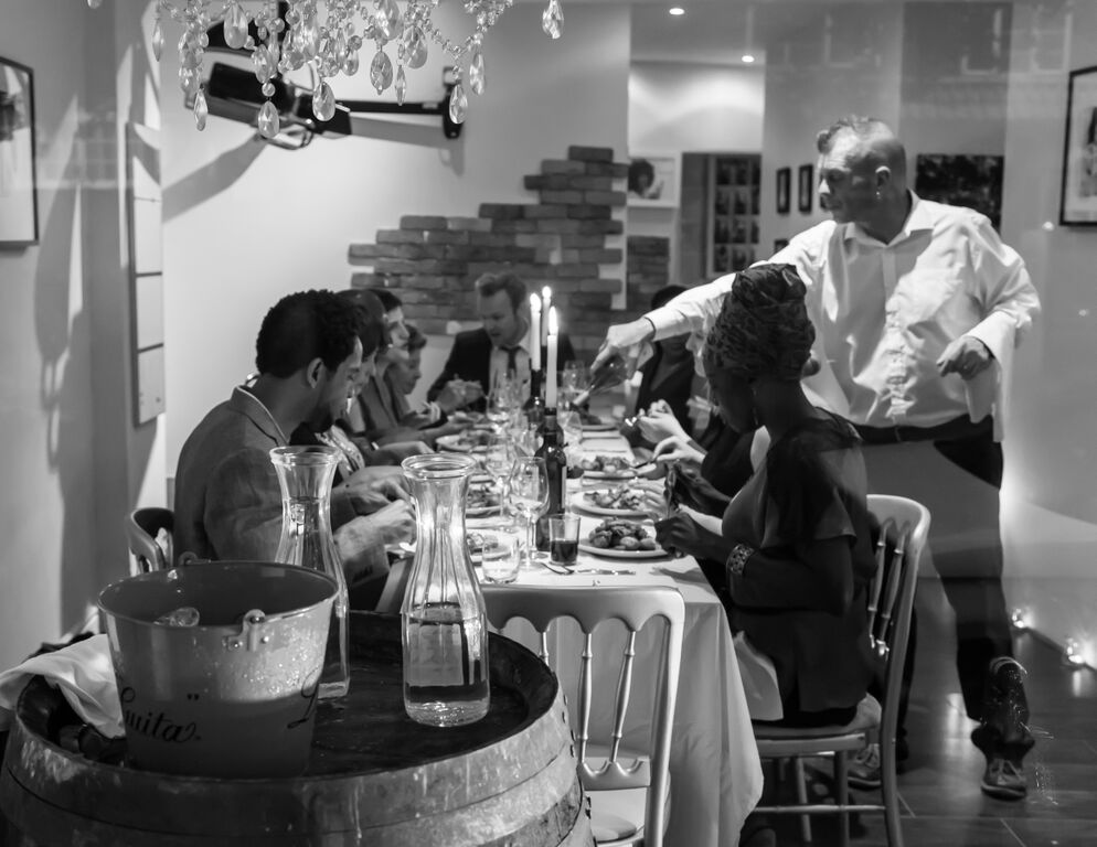 Sophisticated dinner setting with candlelight for networking and intimate gatherings.