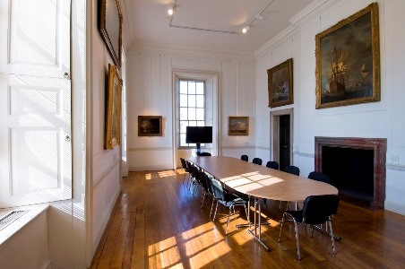 Elegant meeting room in The Queen's House with long table, ideal for events and presentations.