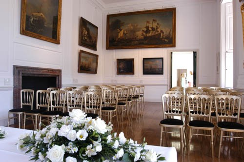 Elegant event space in The Queen's House with gold chairs, ideal for weddings and corporate events.