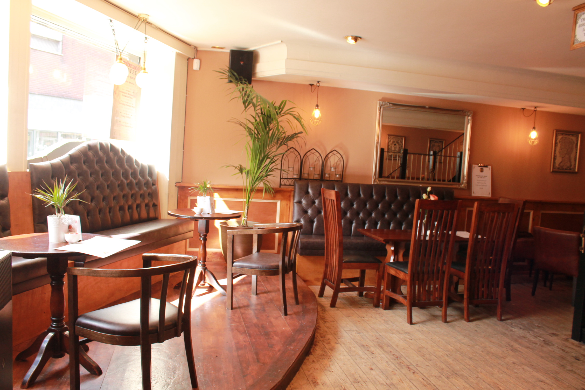 Cozy venue with warm lighting, ideal for intimate gatherings and networking events.