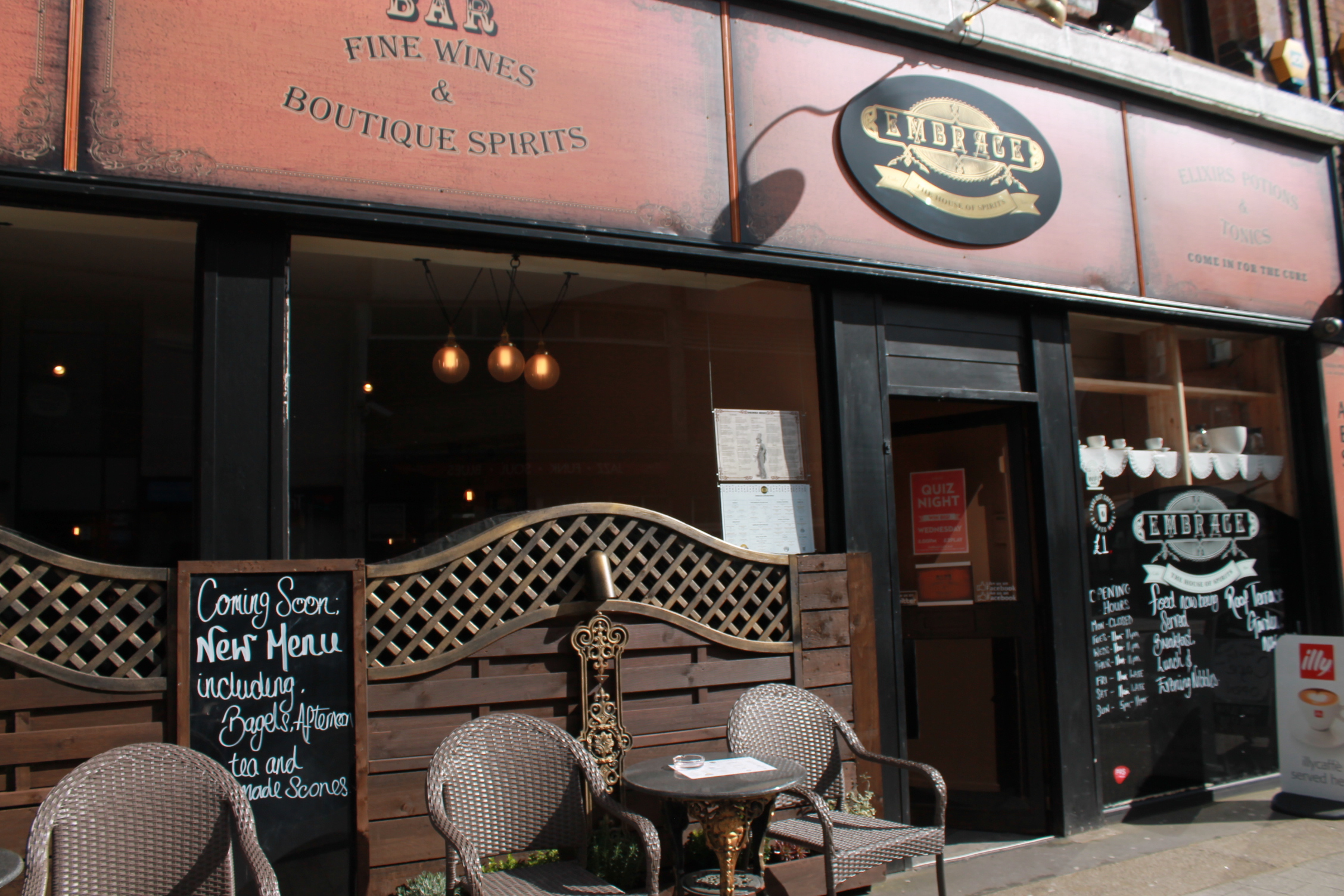 Charming venue exterior with outdoor seating for intimate gatherings and wine tastings.