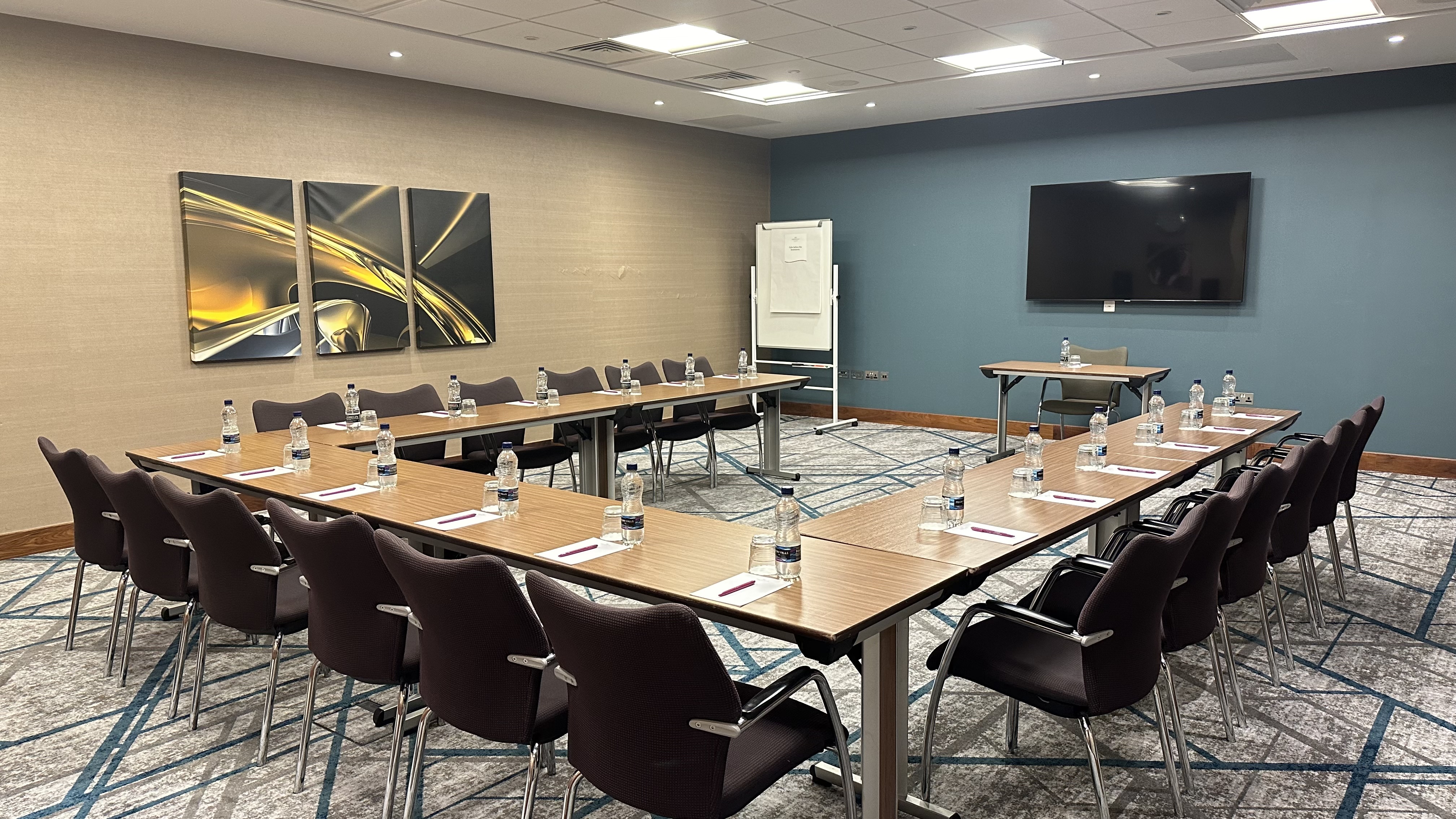 Meeting room at Crowne Plaza Reading East with U-shaped table setup for workshops.