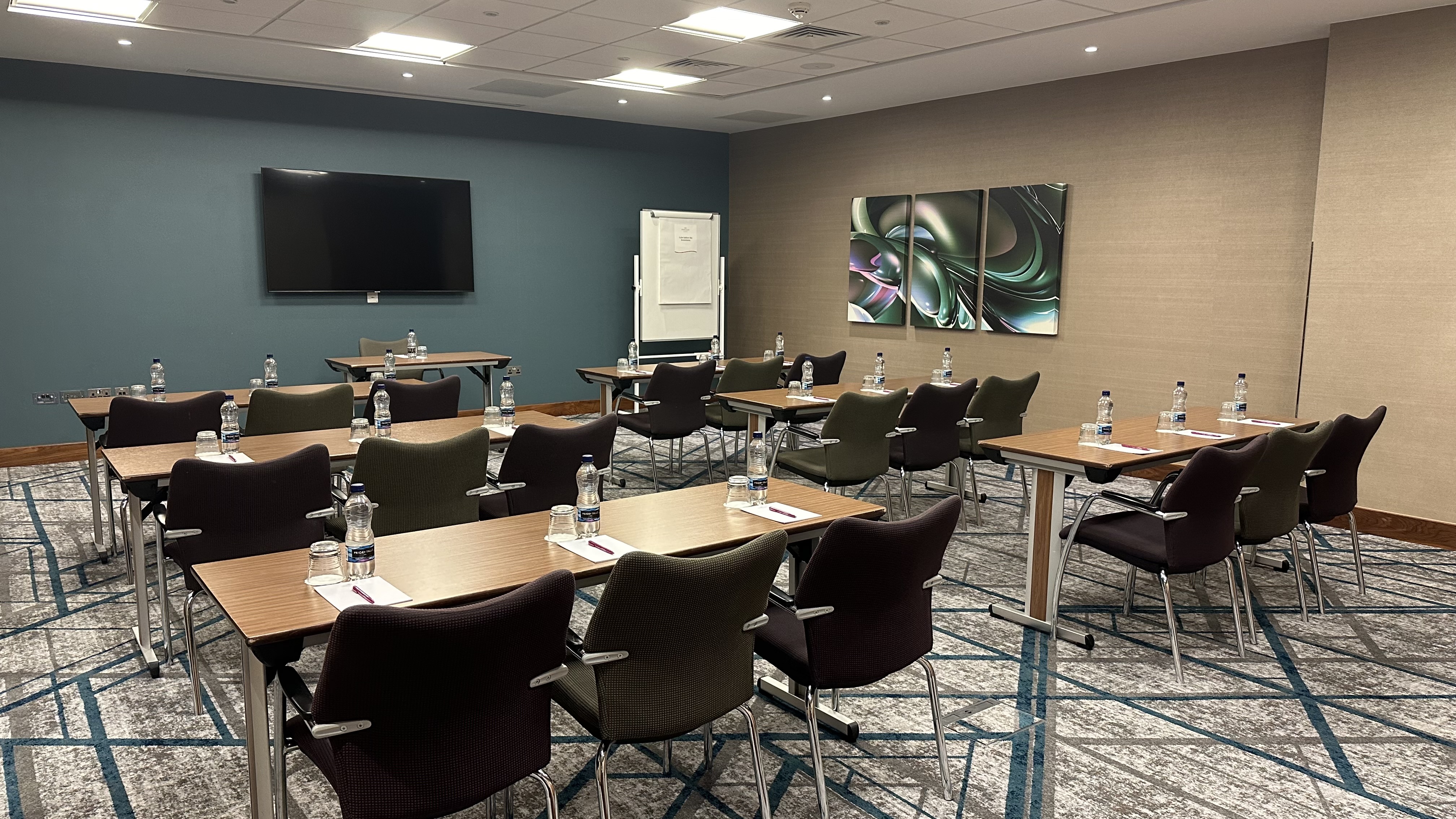 Marlow meeting room at Crowne Plaza, featuring classroom-style tables for professional events.