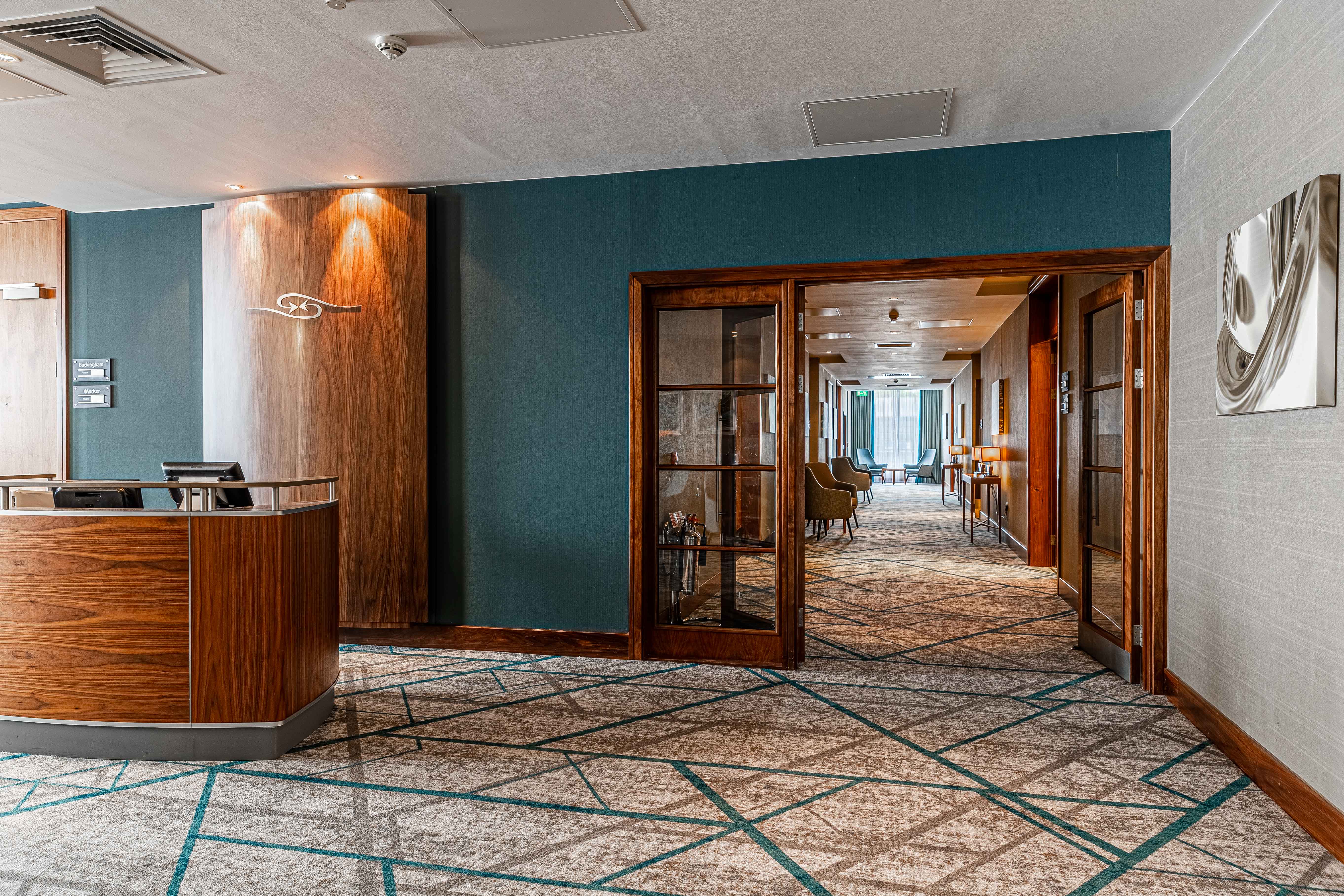 Sandhurst lobby at Crowne Plaza Reading East, modern decor for meetings and events.