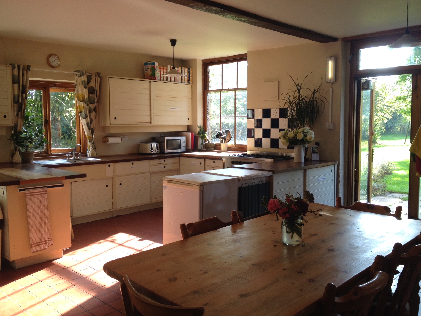 Bright farmhouse kitchen at Inner Wealth Retreat, ideal for events and gatherings.