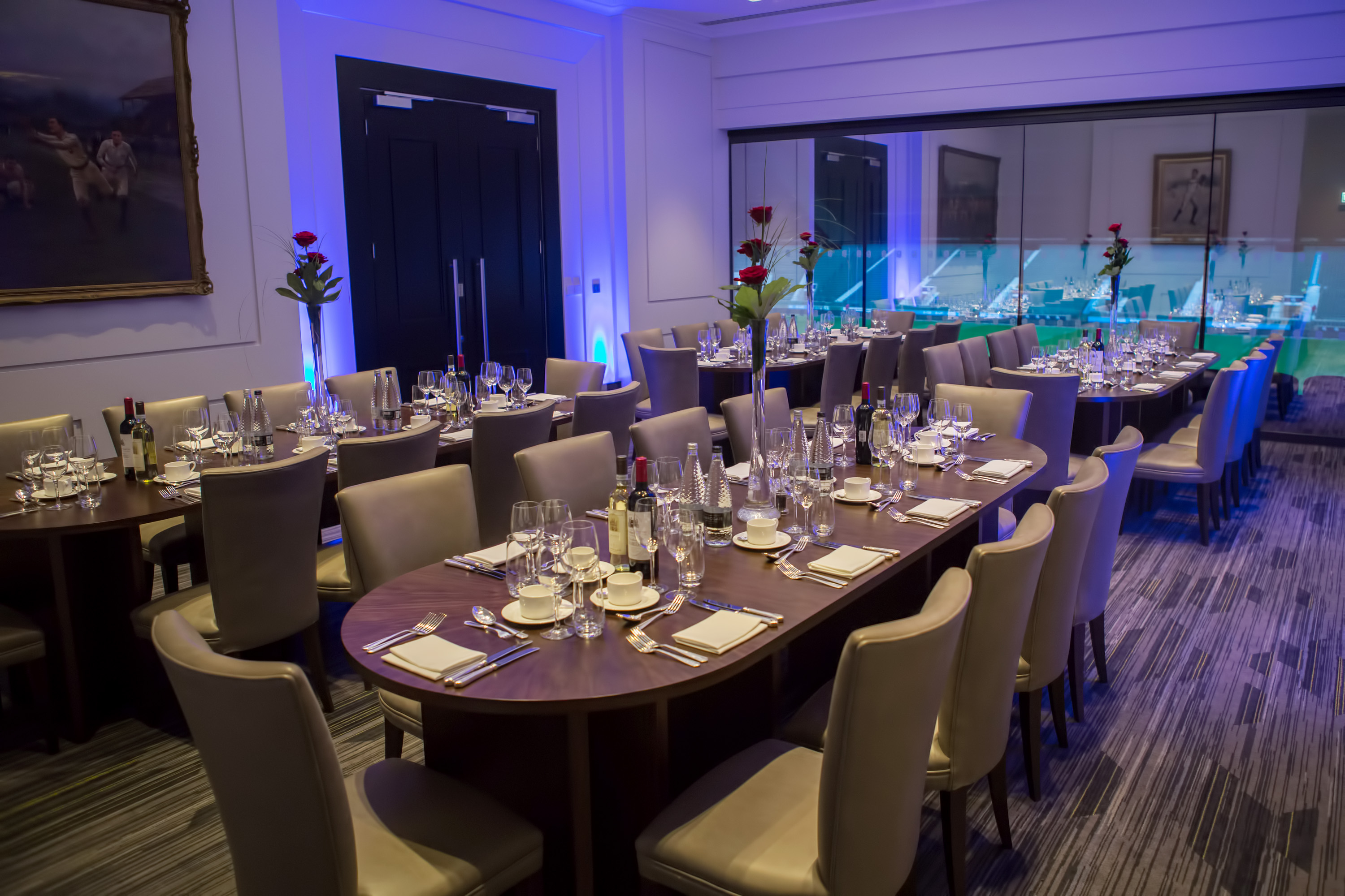 Elegant dining setup in Presidents' Suite, Allianz Stadium for corporate events.
