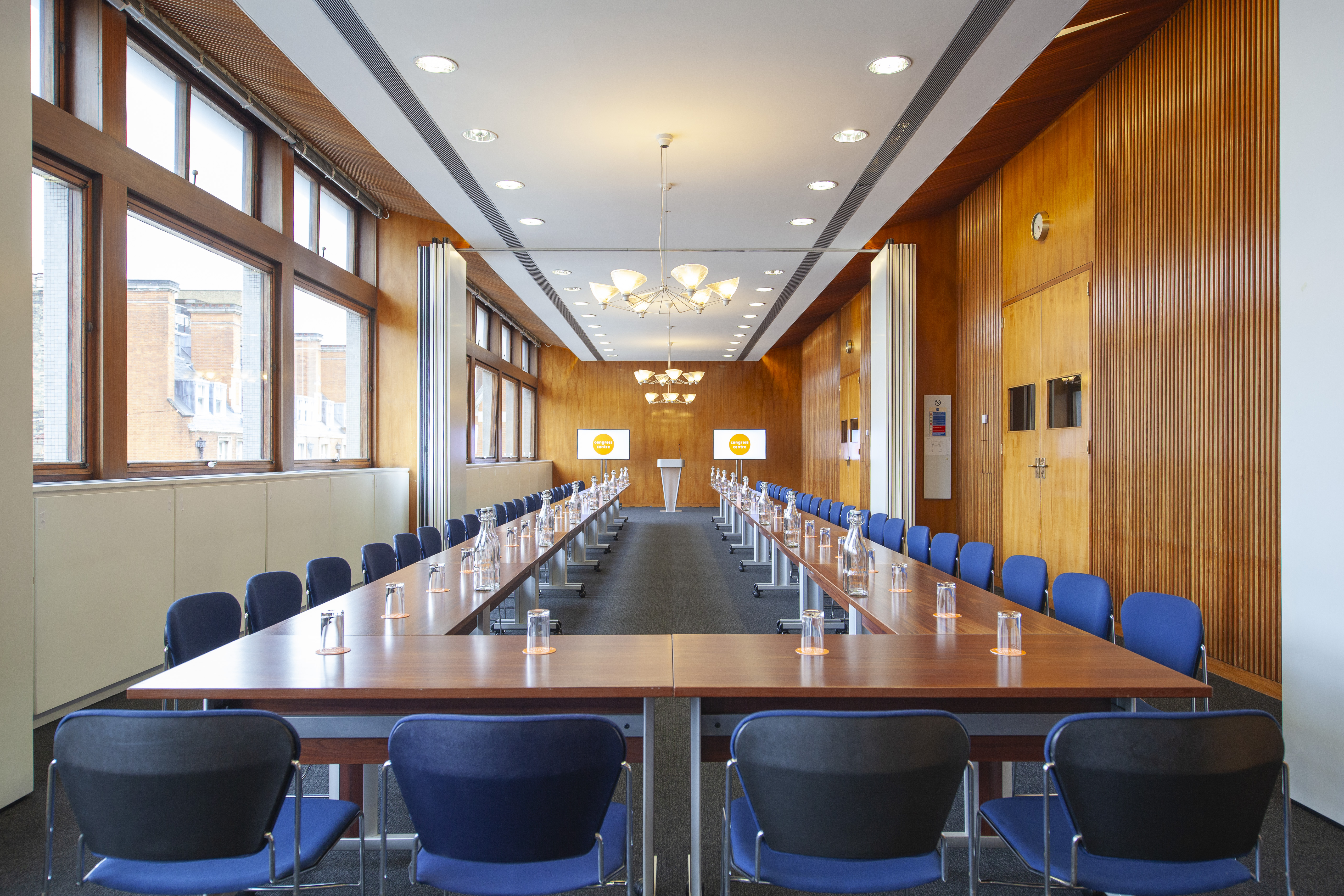 Spacious conference room with natural light for meetings and workshops at Congress Centre.