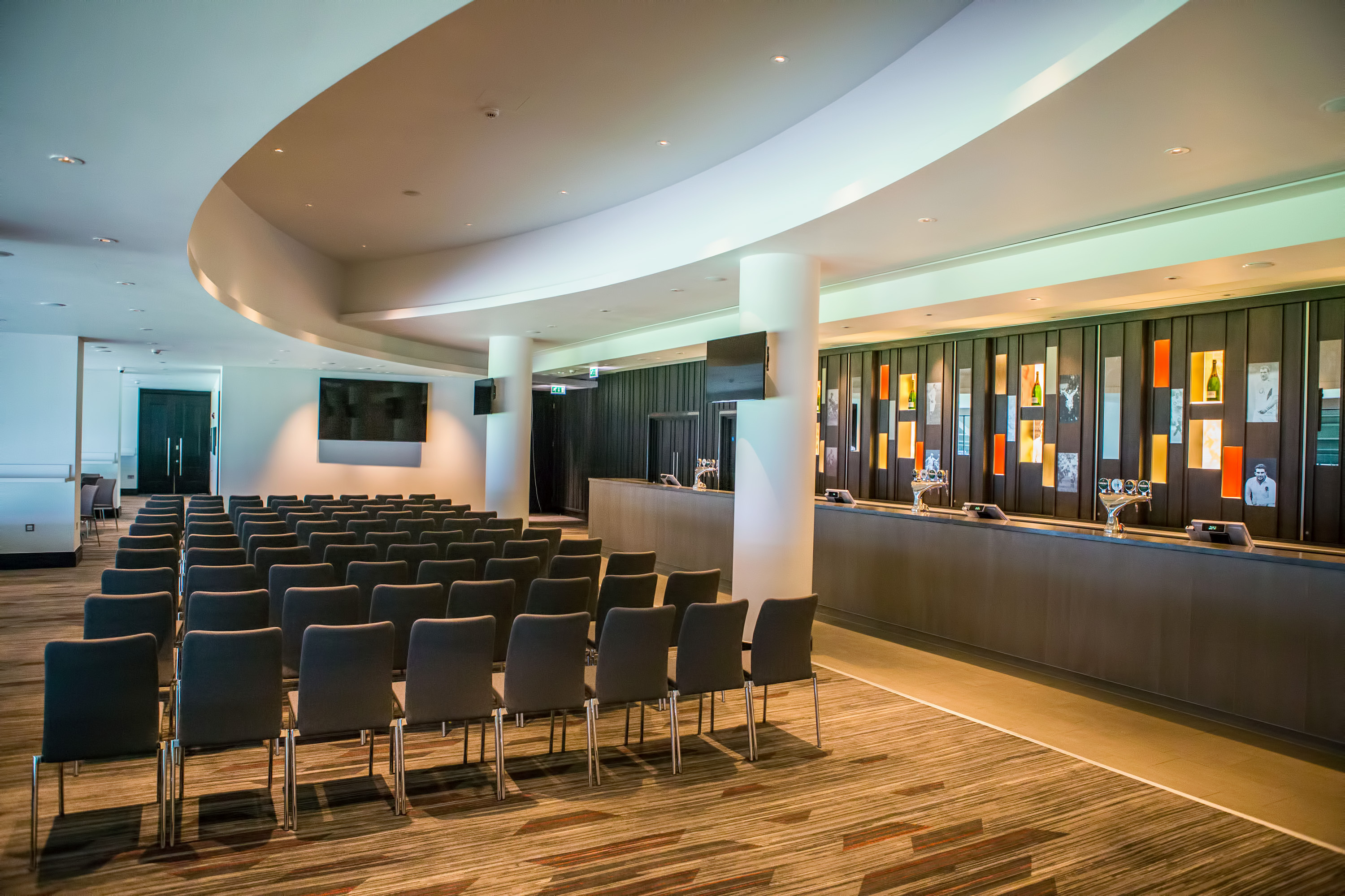Modern Members' Lounge at Allianz Stadium, Twickenham, ideal for conferences and workshops.