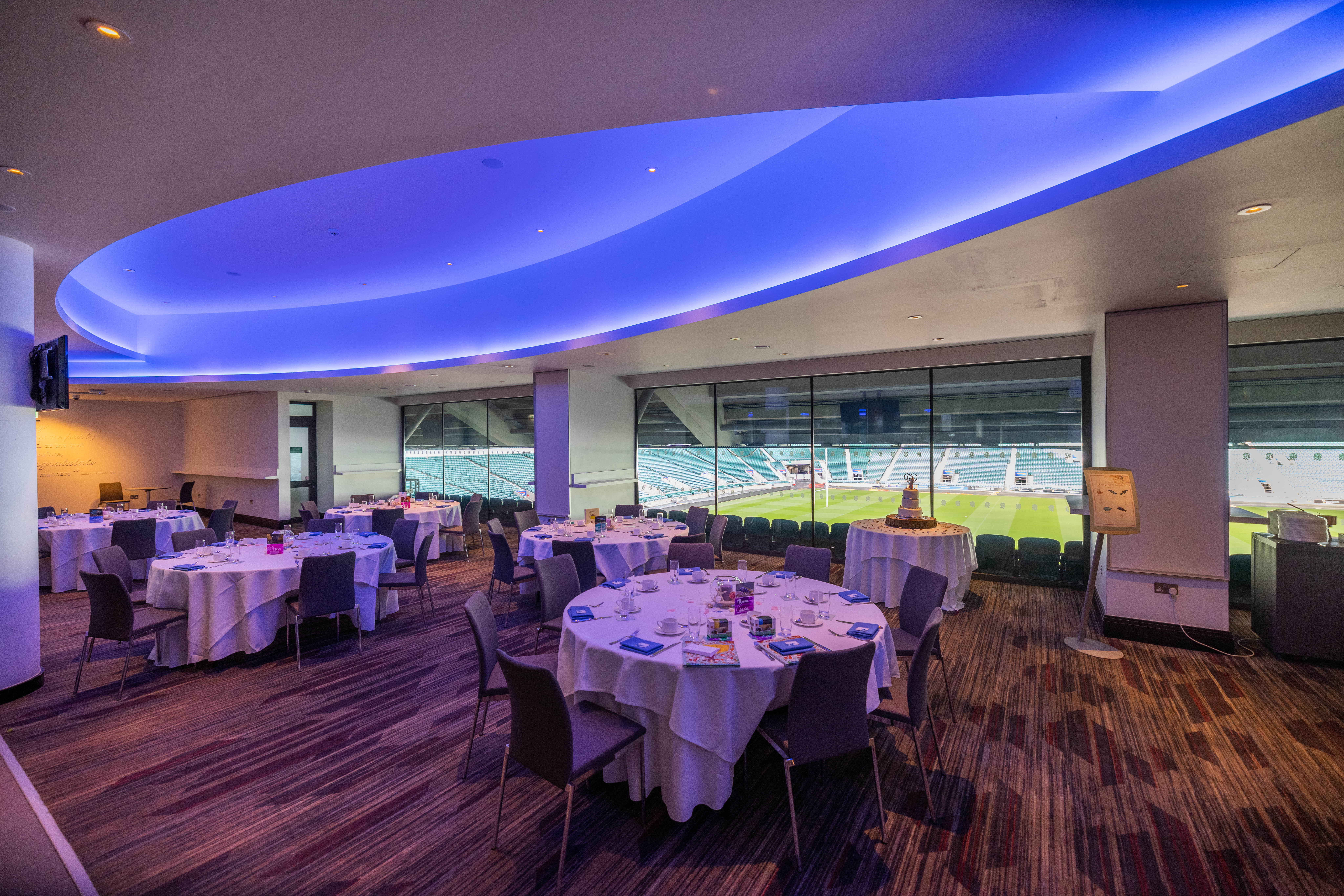 Allianz Stadium Members' Lounge: modern event space with elegant tables for corporate events.
