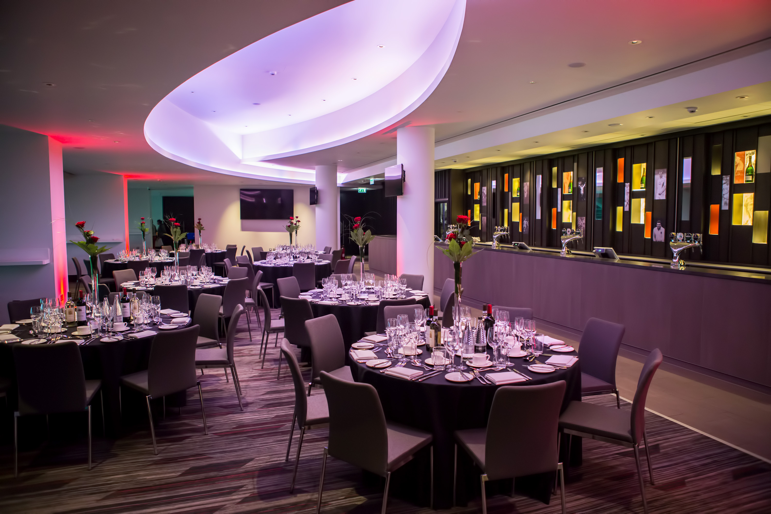 Elegant Members' Lounge at Allianz Stadium, Twickenham, set for a formal dinner event.