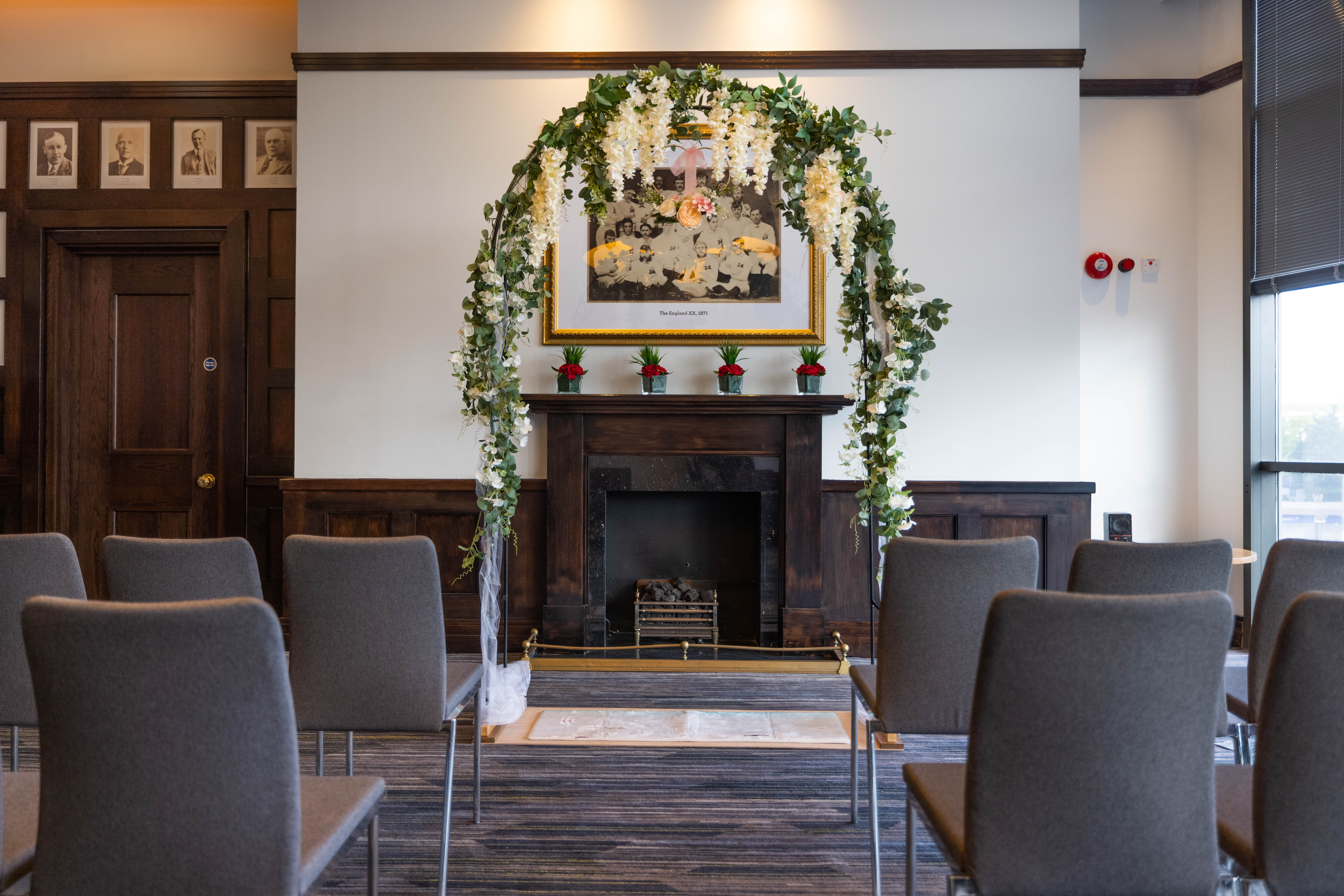 Council Room at Allianz Stadium with floral arch, perfect for weddings and events.