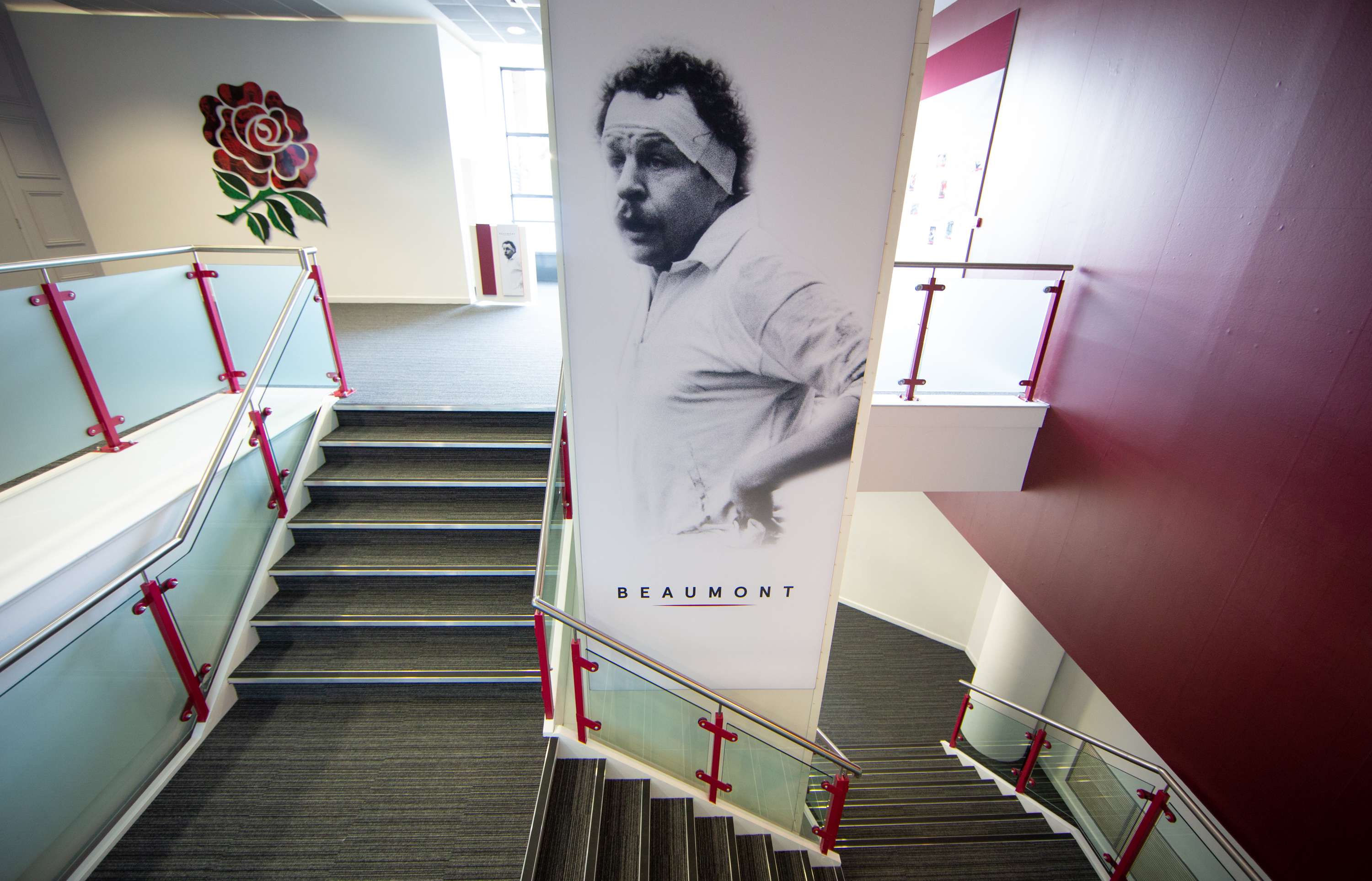 Modern staircase with mural at Allianz Stadium, ideal for networking events and meetings.
