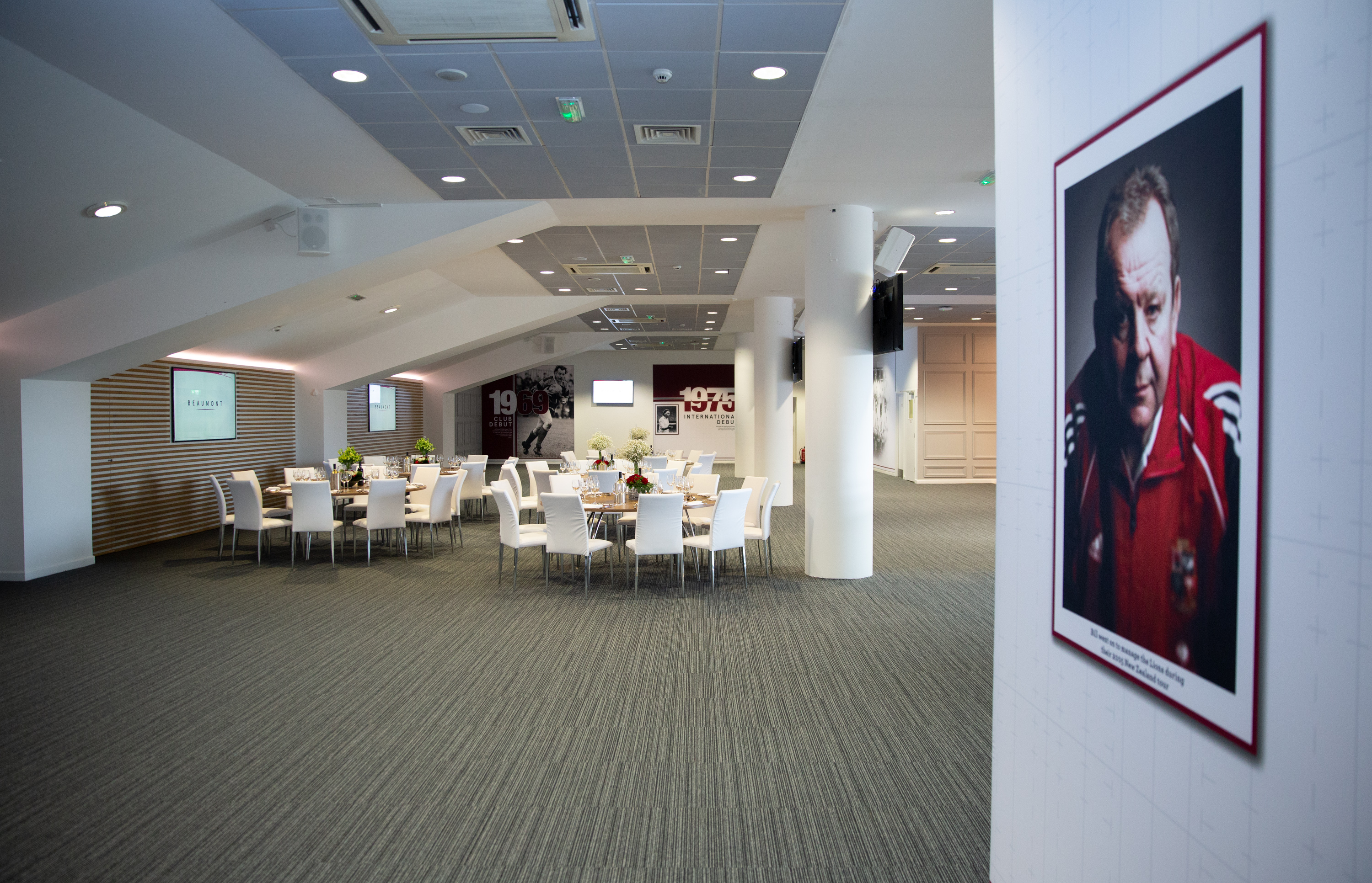 Modern event space with round tables at Allianz Stadium, ideal for corporate meetings.