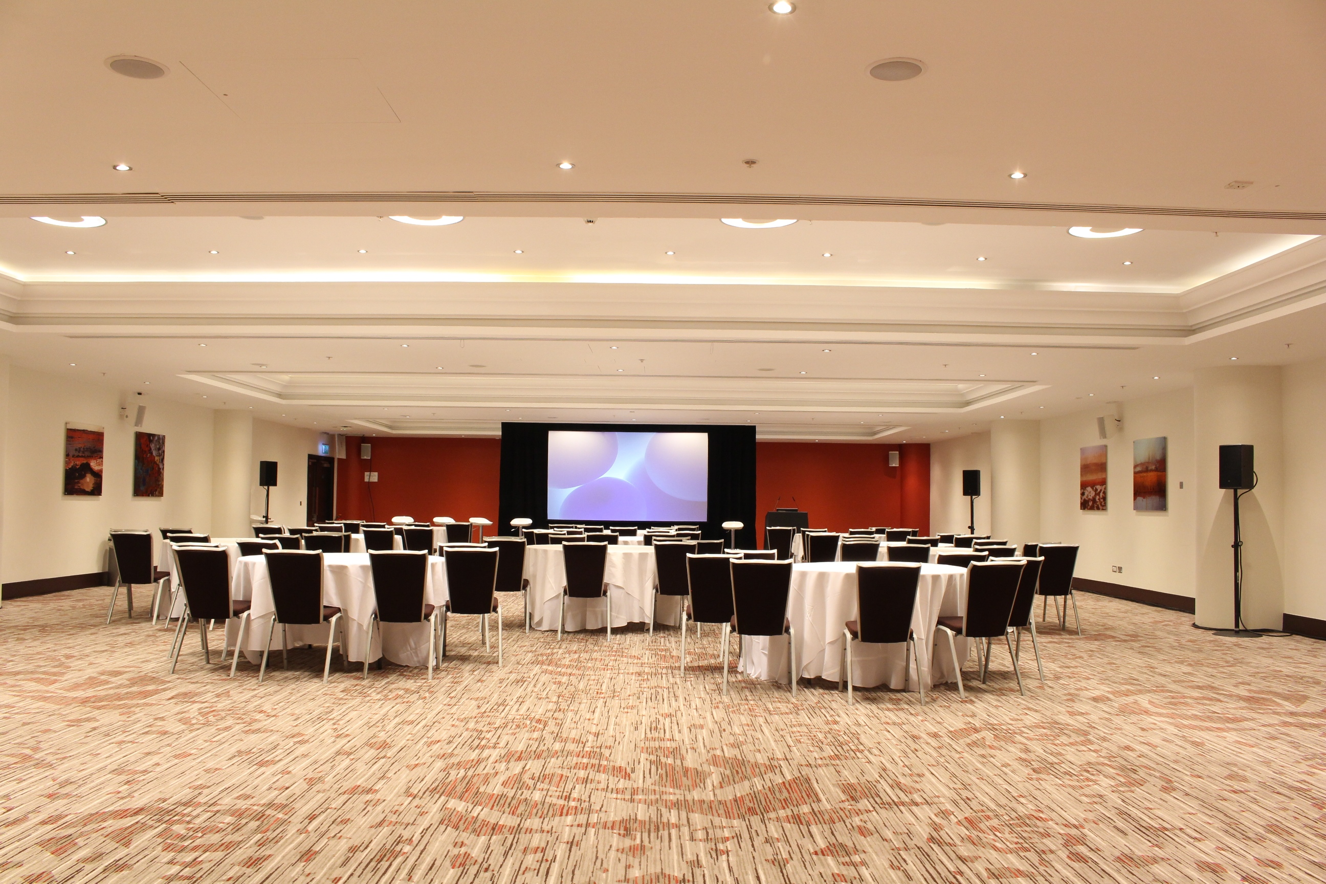 Churchill Suite at Allianz Stadium, Twickenham: corporate event space with round tables.