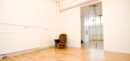 Old Street Studio 2, London: minimalist event space with vintage chair for workshops.