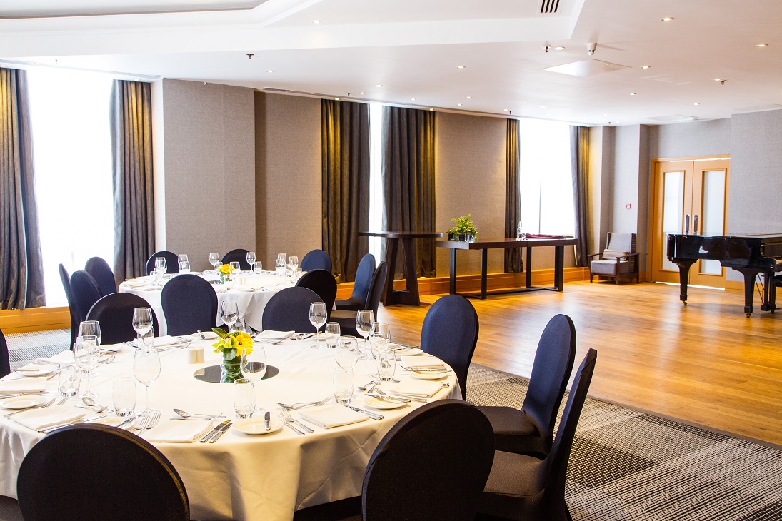 Sonata Suite at Hyatt Regency Birmingham, elegant event space with floral centerpieces.