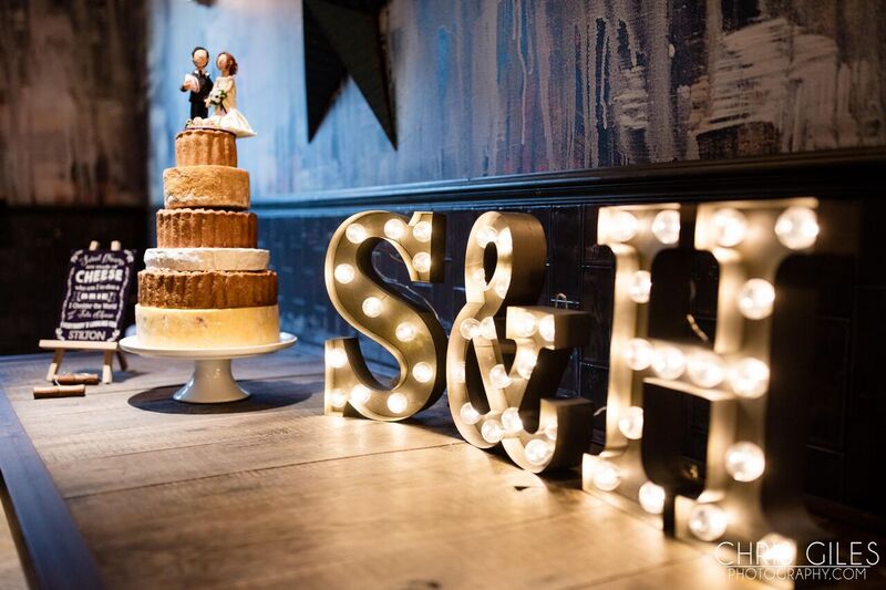 Wedding cake with marquee letters "S&H" at Main Bar & Lounge, St Bart's celebration.