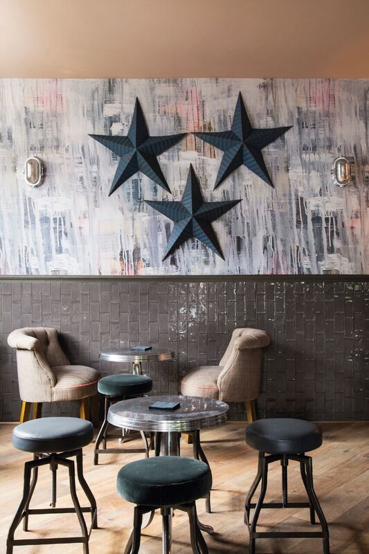 Stylish meeting space with plush chairs at Main Bar & Lounge, ideal for networking events.