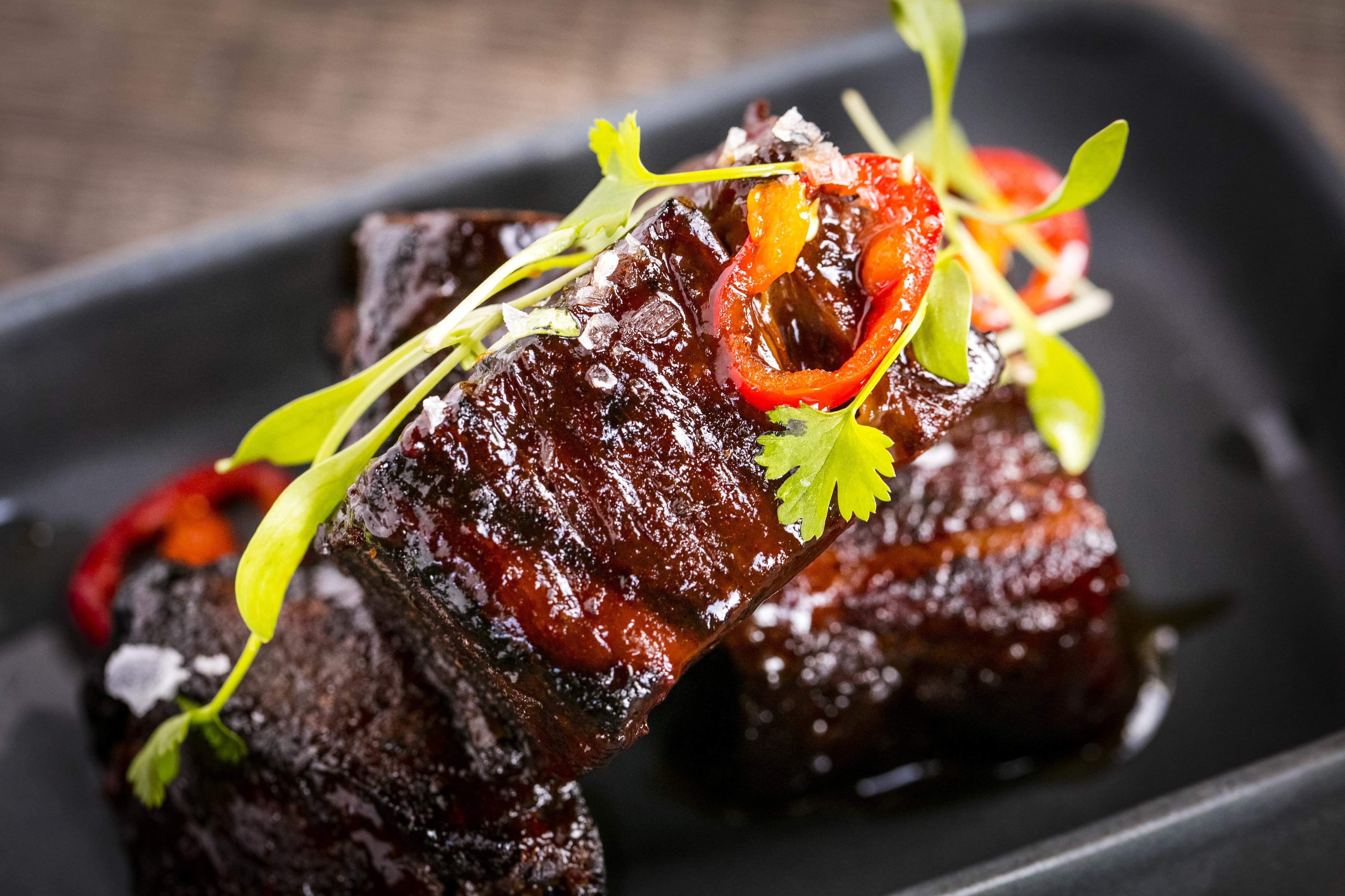 Succulent glazed meat dish at Main Bar & Lounge, St Bart's event catering.