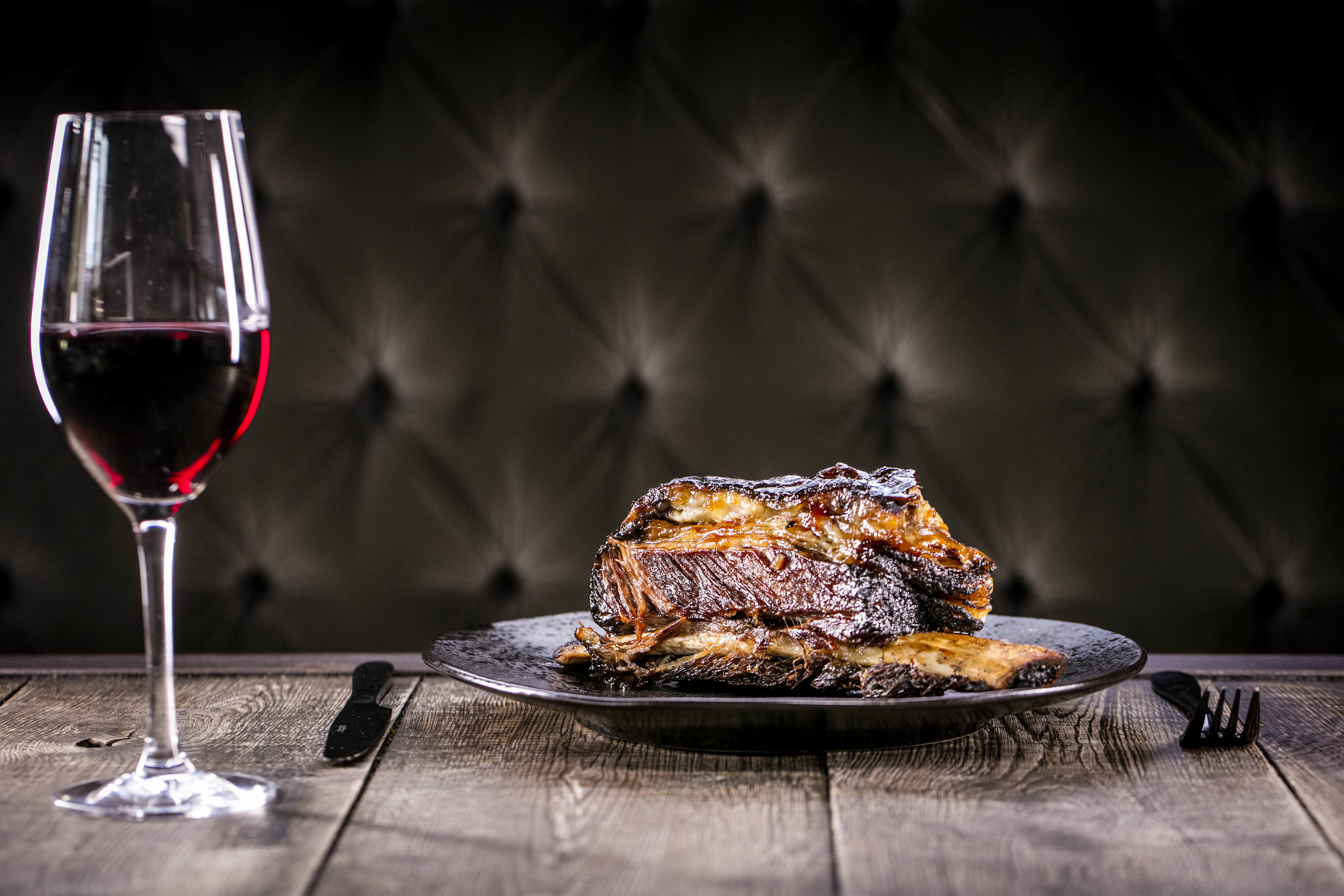 Elegant meat dish with red wine, perfect for upscale dining events in Balfour St Bart's.