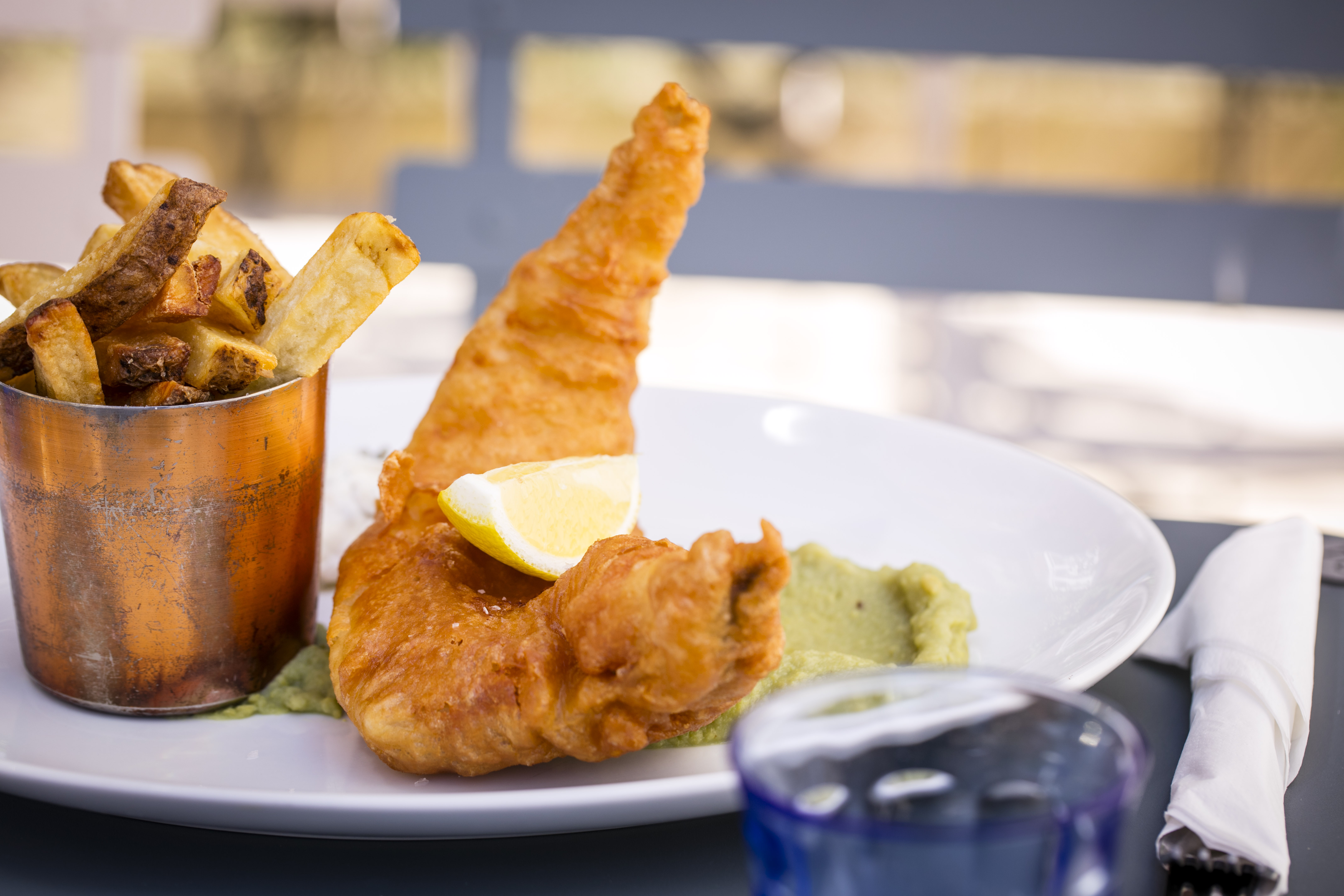 Crispy fried fish fillet with fries at Balfour St Bart's for networking events.