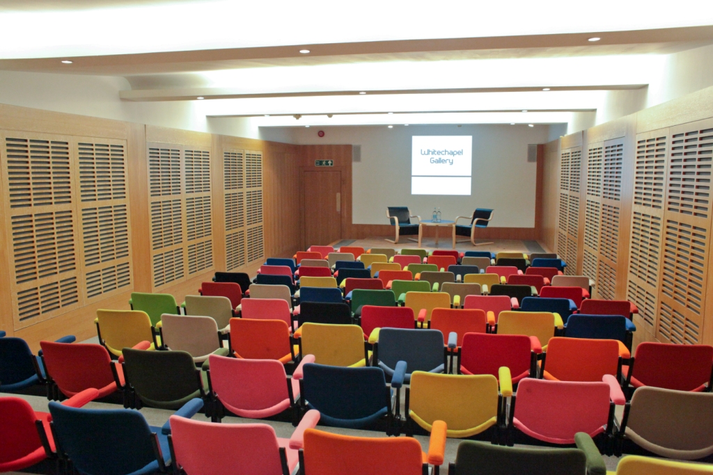Zilkha Auditorium with vibrant seating, ideal for engaging workshops and presentations.