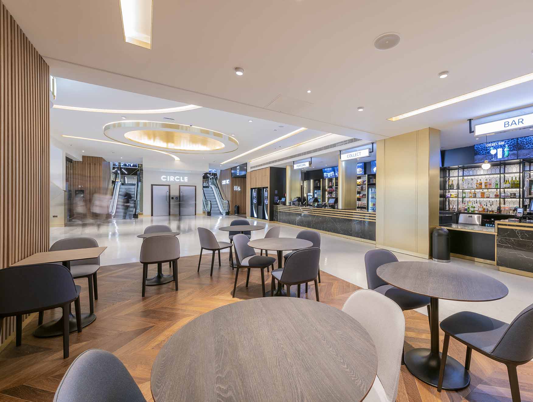 Modern event space at ODEON LUXE Leicester Square with sleek furniture and bar.
