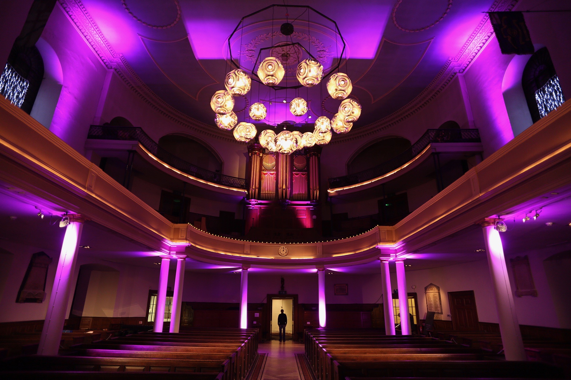 Elegant event space with purple lighting, ideal for weddings and corporate events.