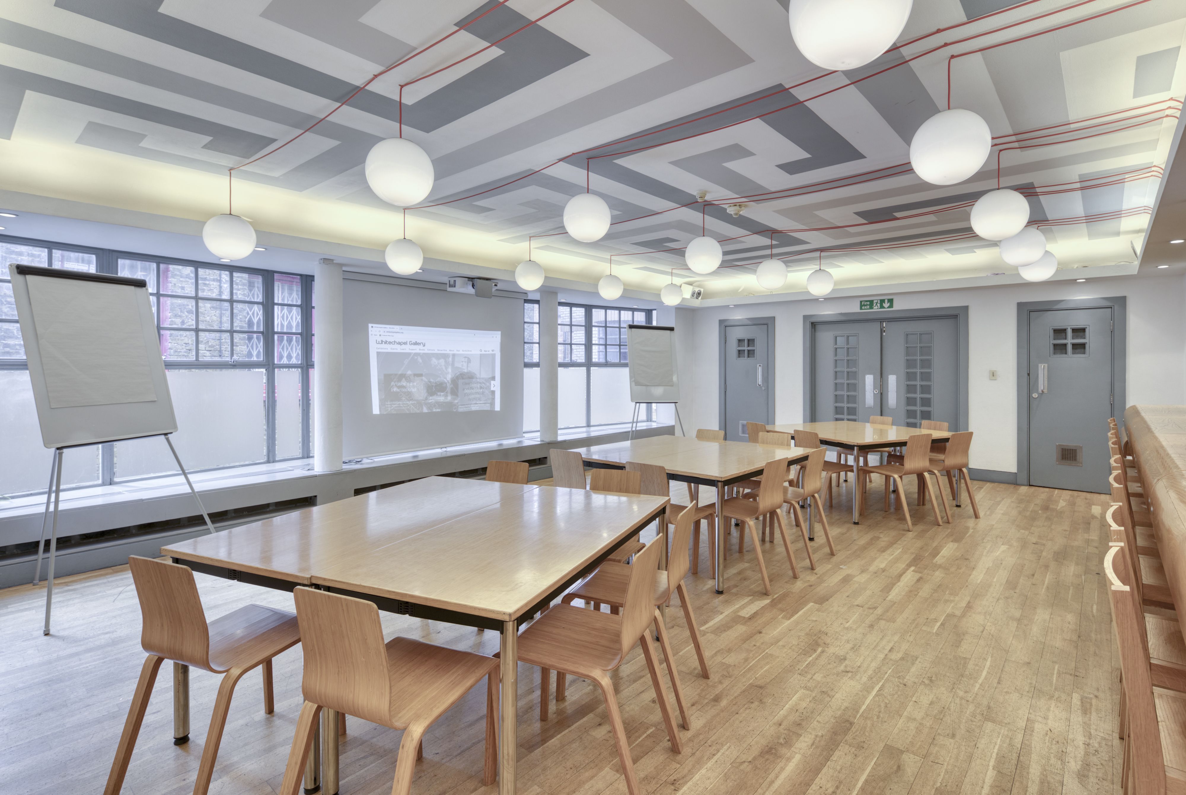 Modern meeting space in Whitechapel Gallery with flexible seating for workshops and brainstorming.