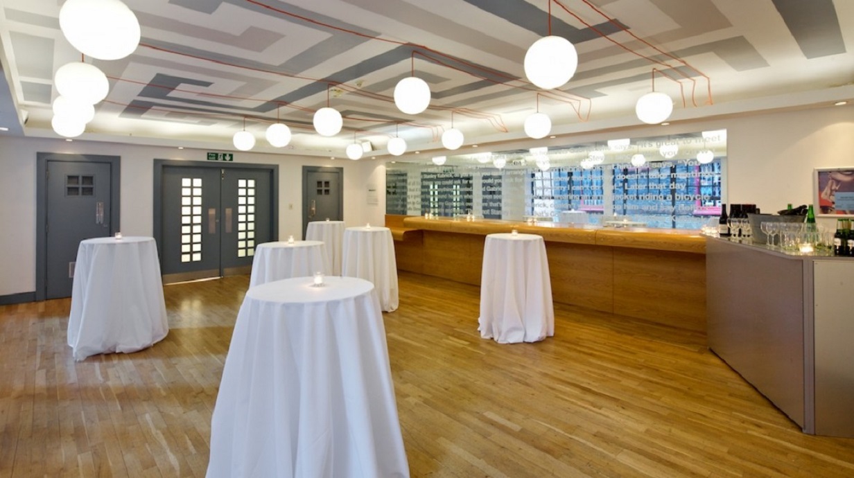Elegant event space in Whitechapel Gallery with high-top tables for networking and receptions.