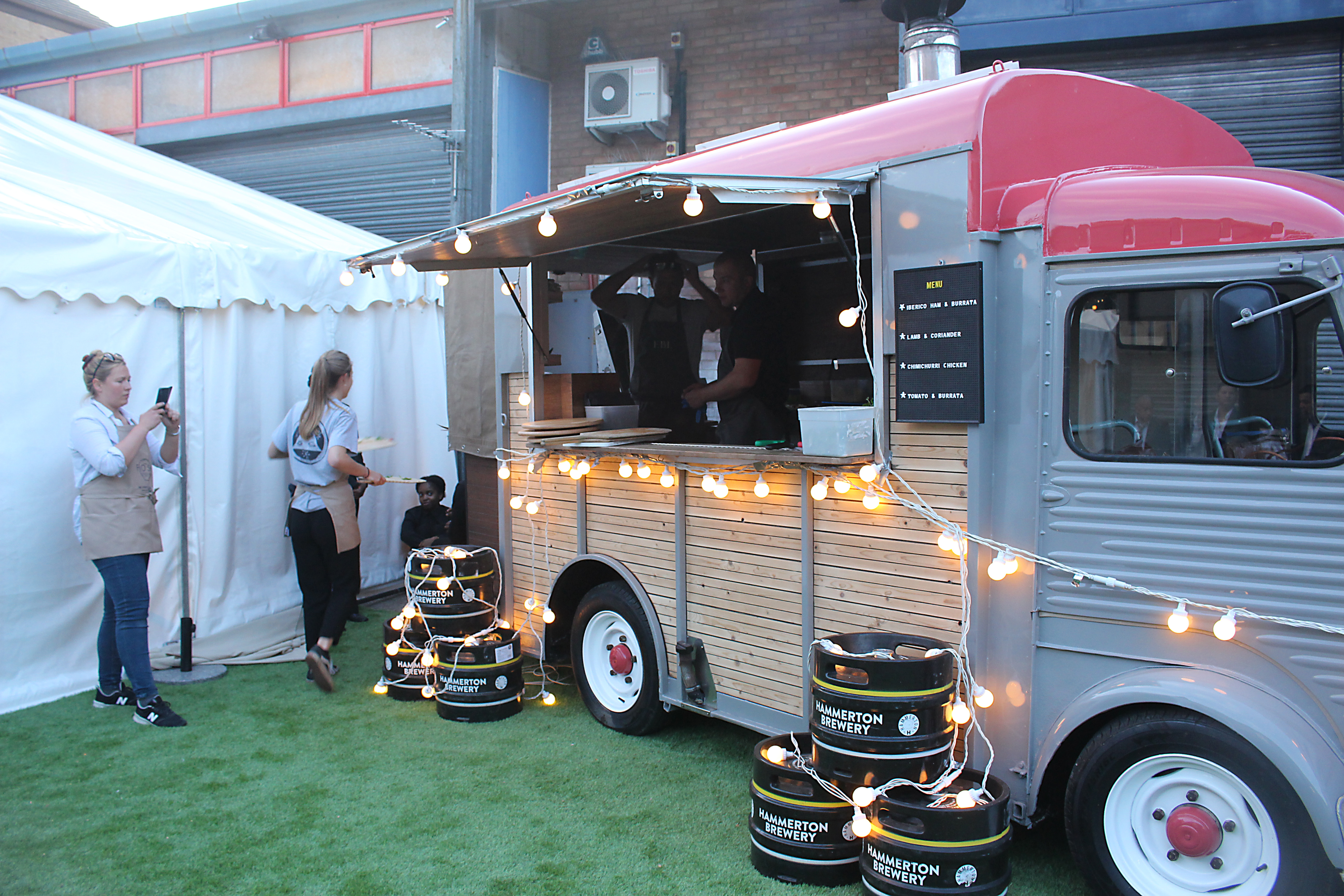 Charming food truck setup with string lights at Hammerton Brewery for outdoor events.